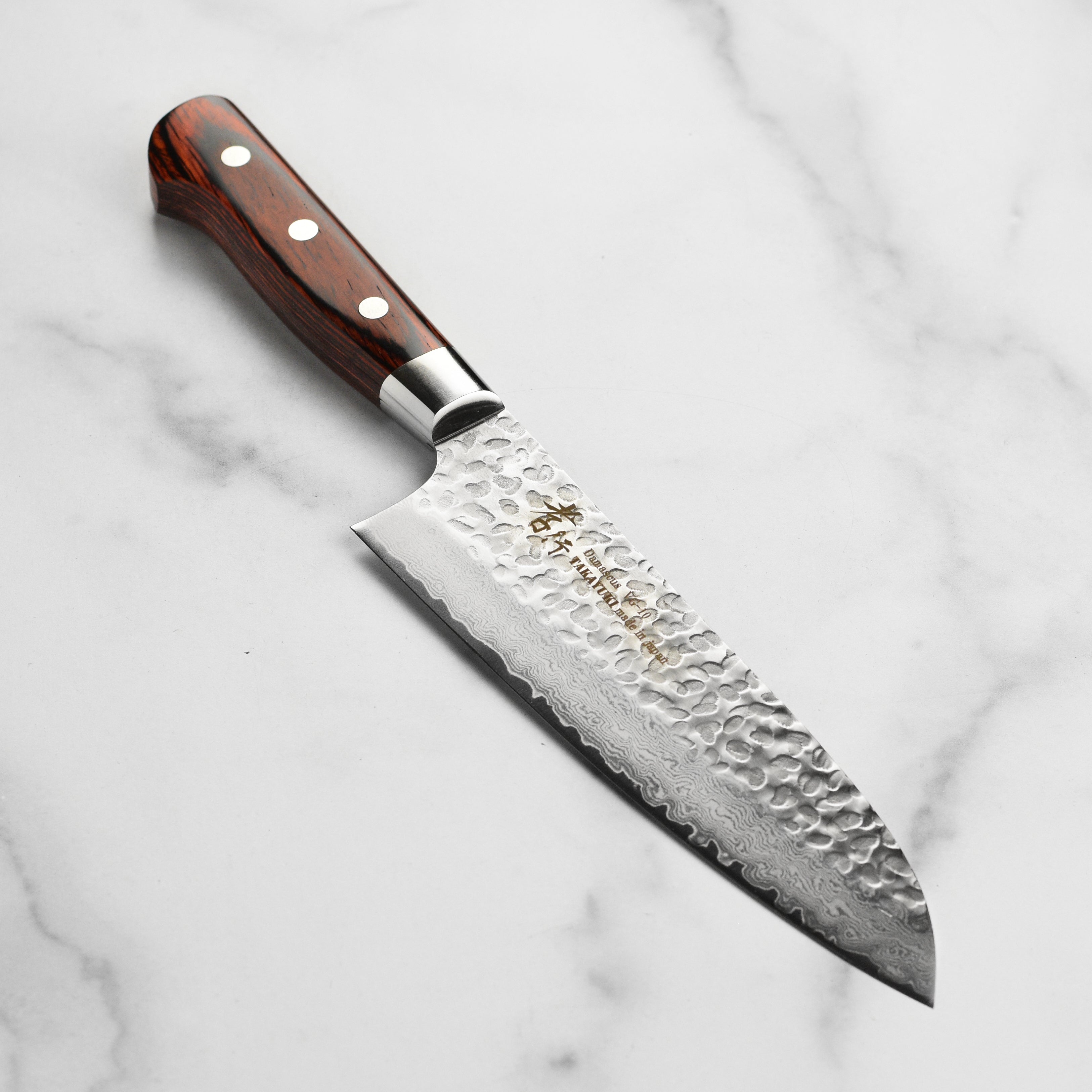 Takayuki hammered damascus santoku knife with detailed blade pattern and full tang handle
