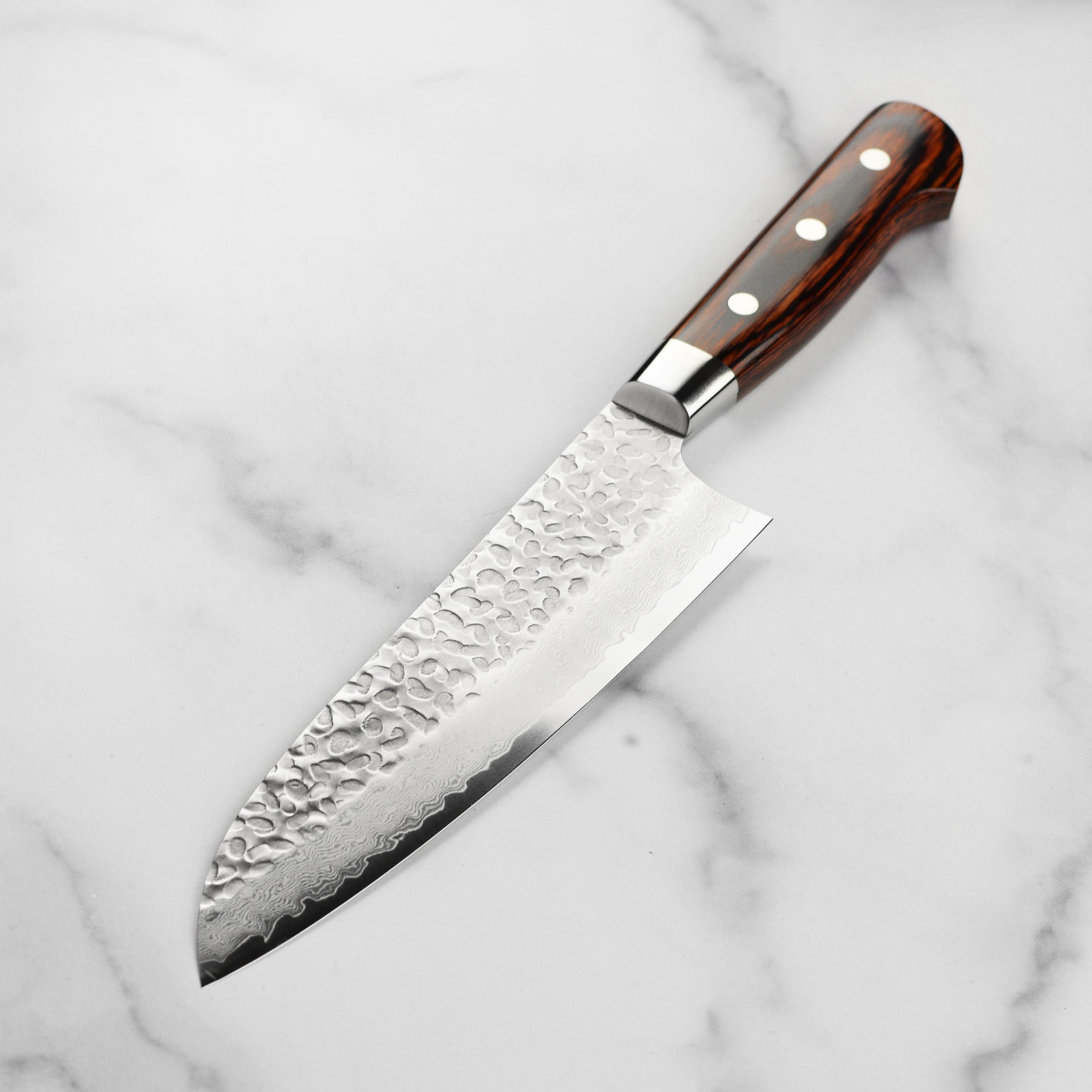 Professional santoku knife in action, slicing vegetables with precision
