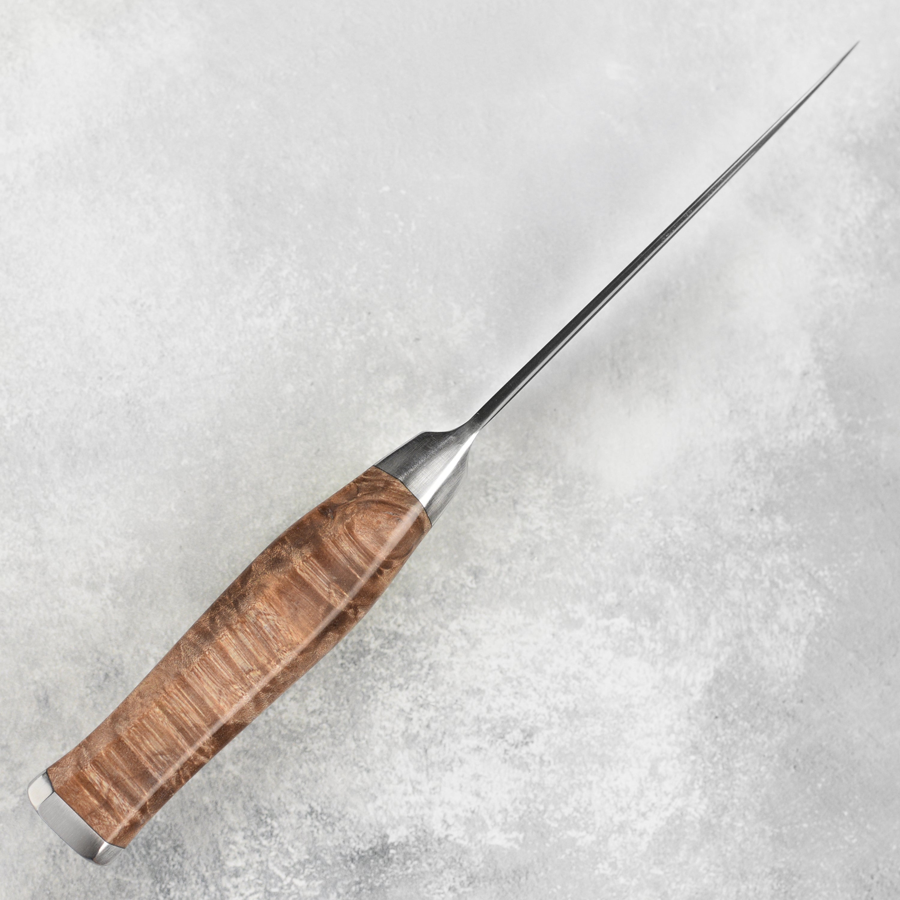 Steelport steak knife set with case displayed on a kitchen counter.