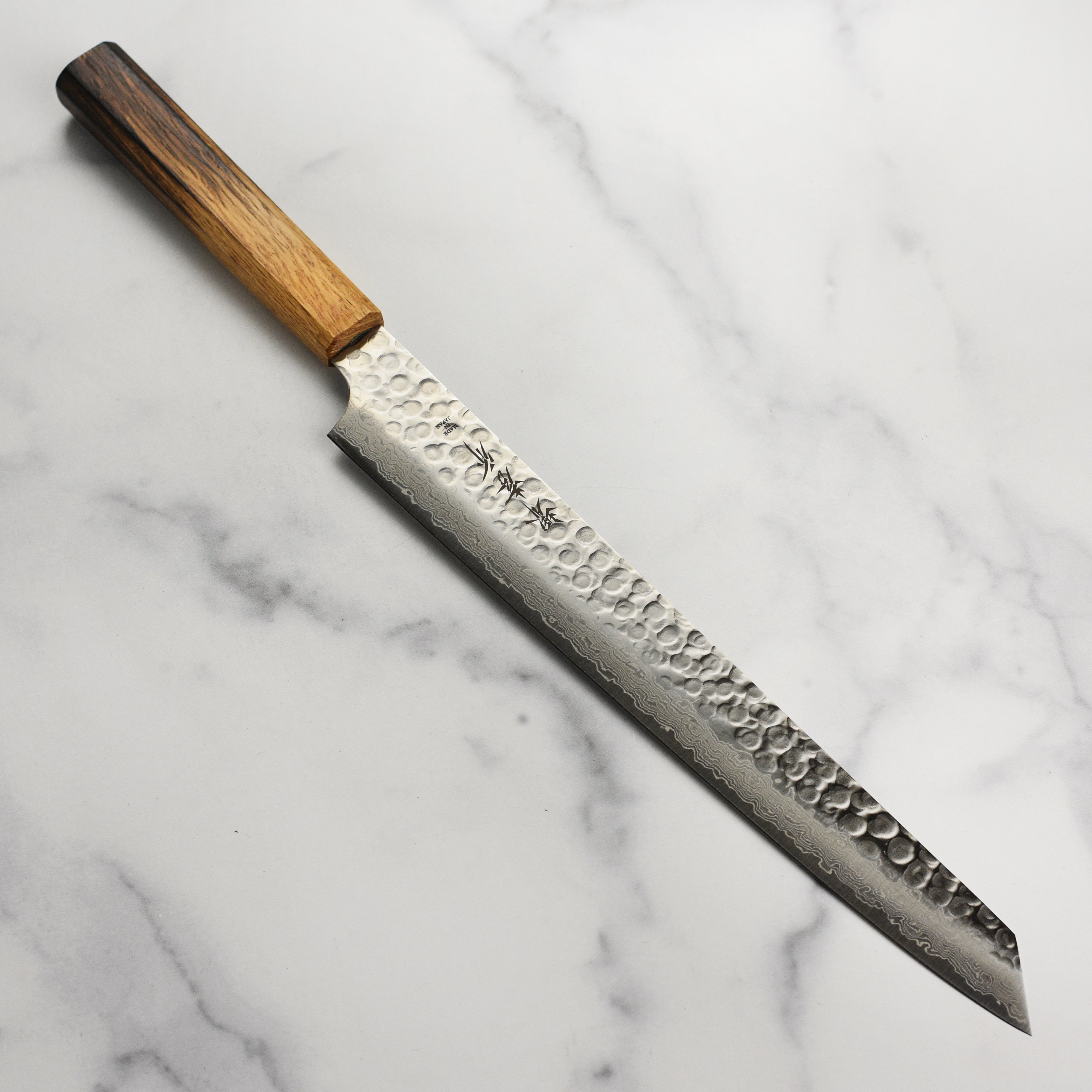 Sakai Tsuchime Damascus Chef Knife with a close-up of the blade and handle.