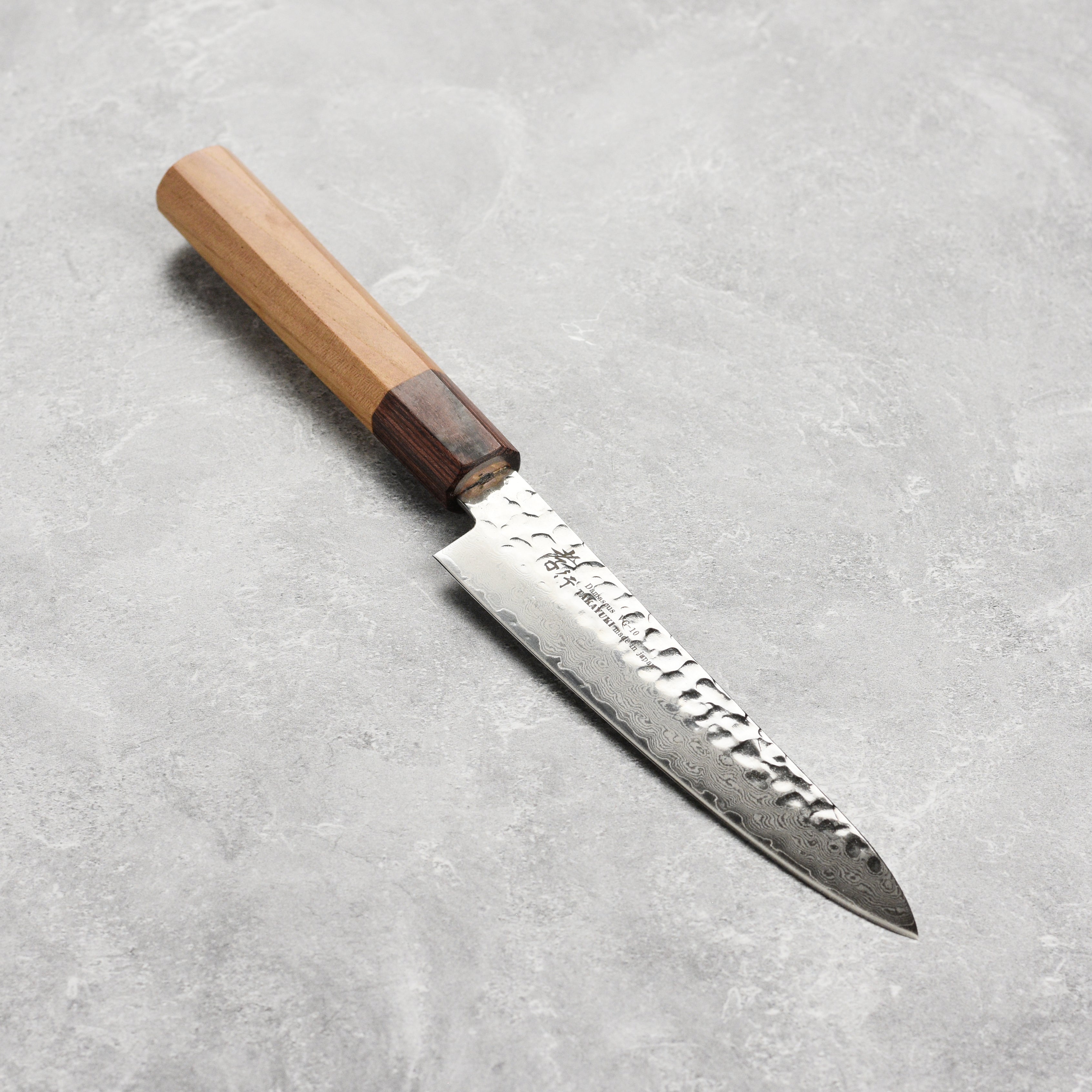 Close-up of the blade of the premium Japanese damascus petty knife, highlighting the 33-layer design and VG10 steel core.
