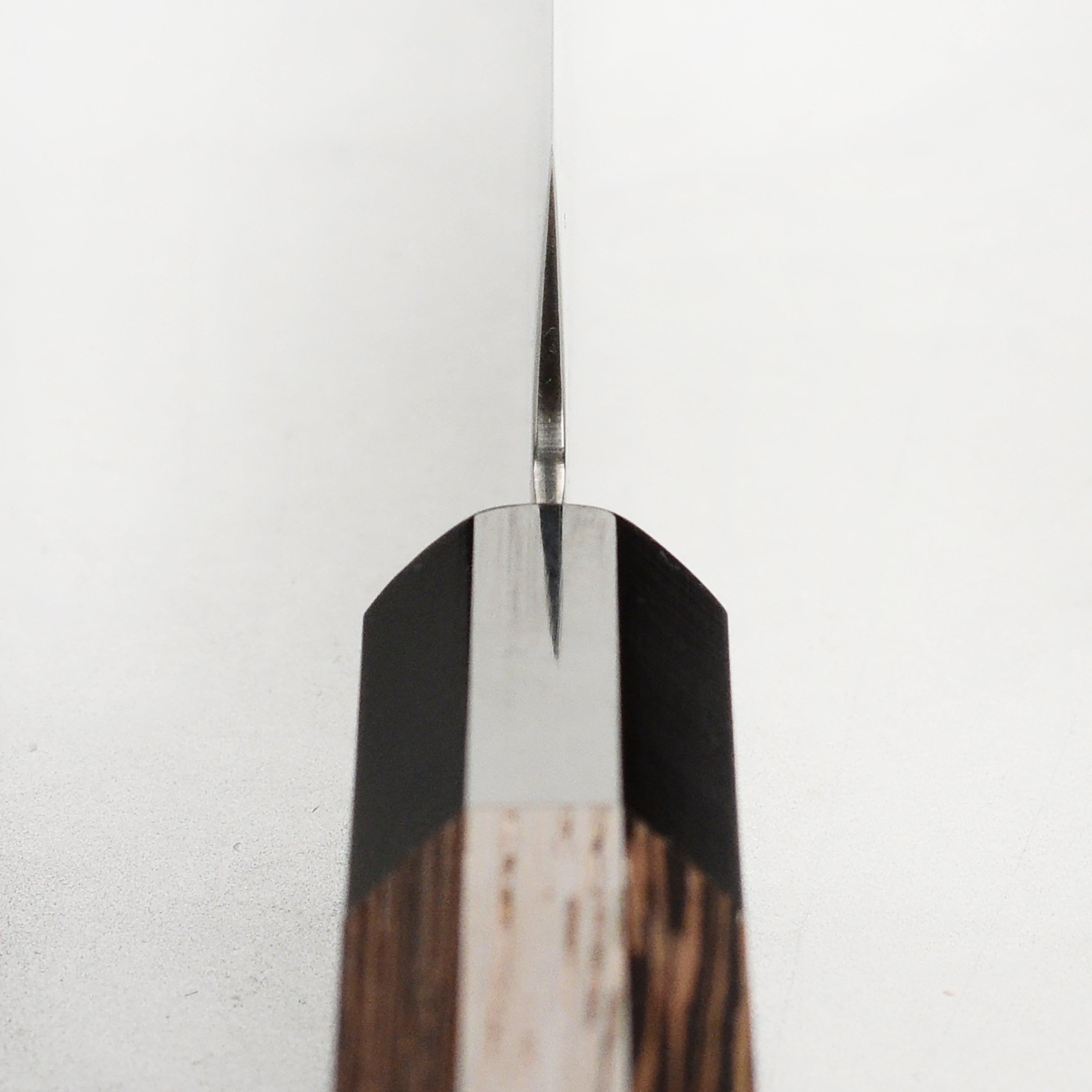 Takayuki Ginga ZA-18 petty knife in action, slicing fresh vegetables with precision.
