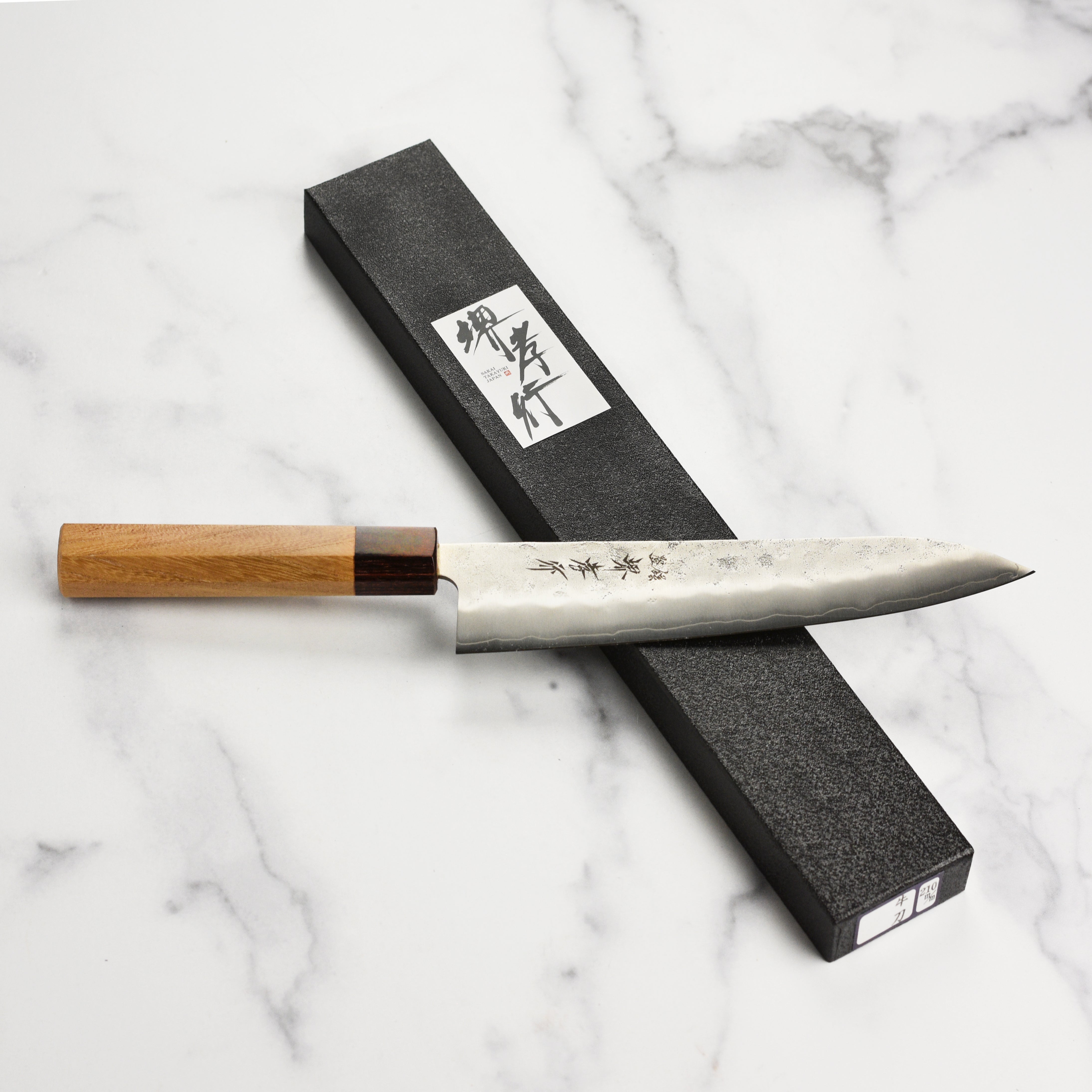 Close-up of stainless steel Ginsan blade showcasing craftsmanship and design