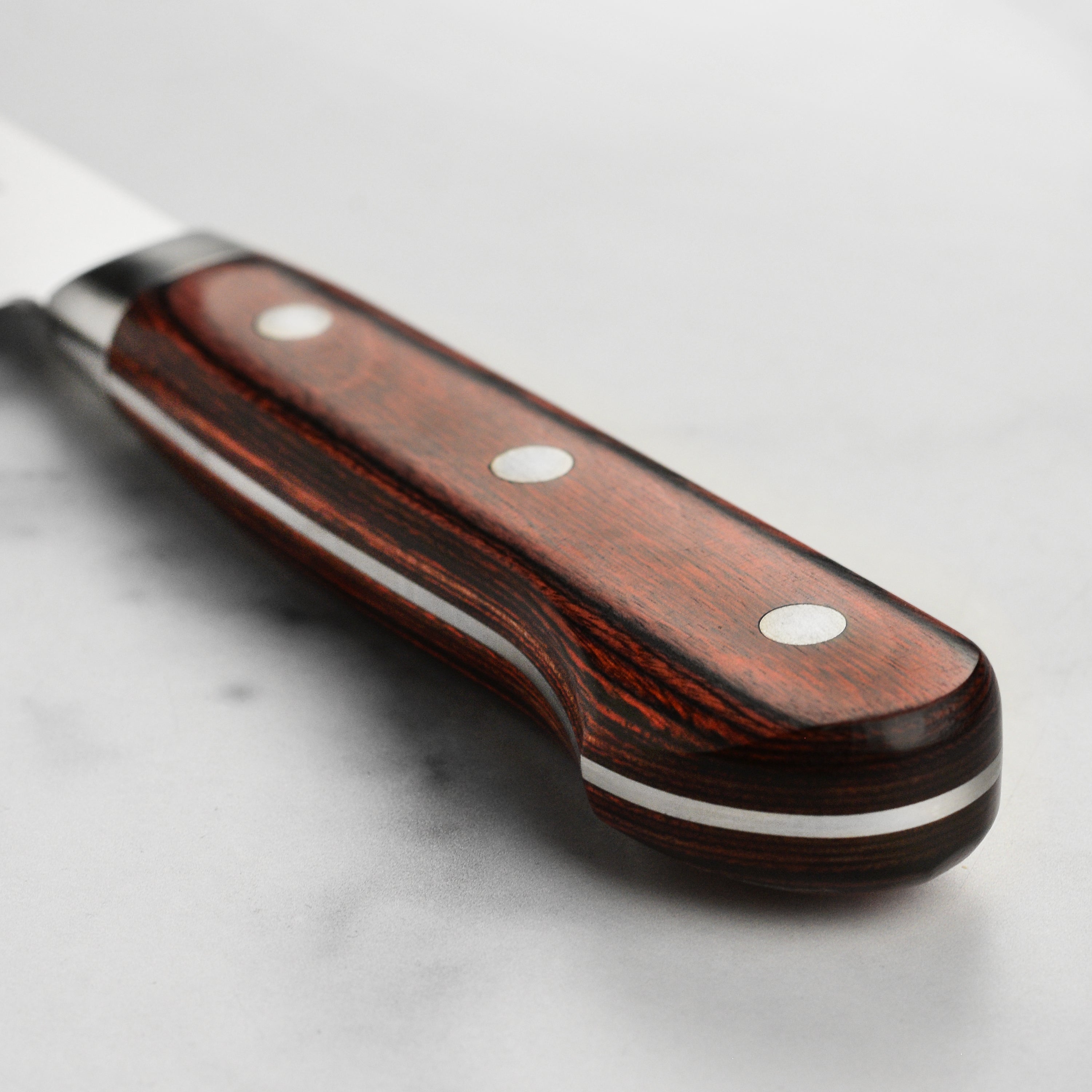 Top view of the Senzo Clad AUS10 6.5-inch Bunka Knife showcasing its craftsmanship and blade edge
