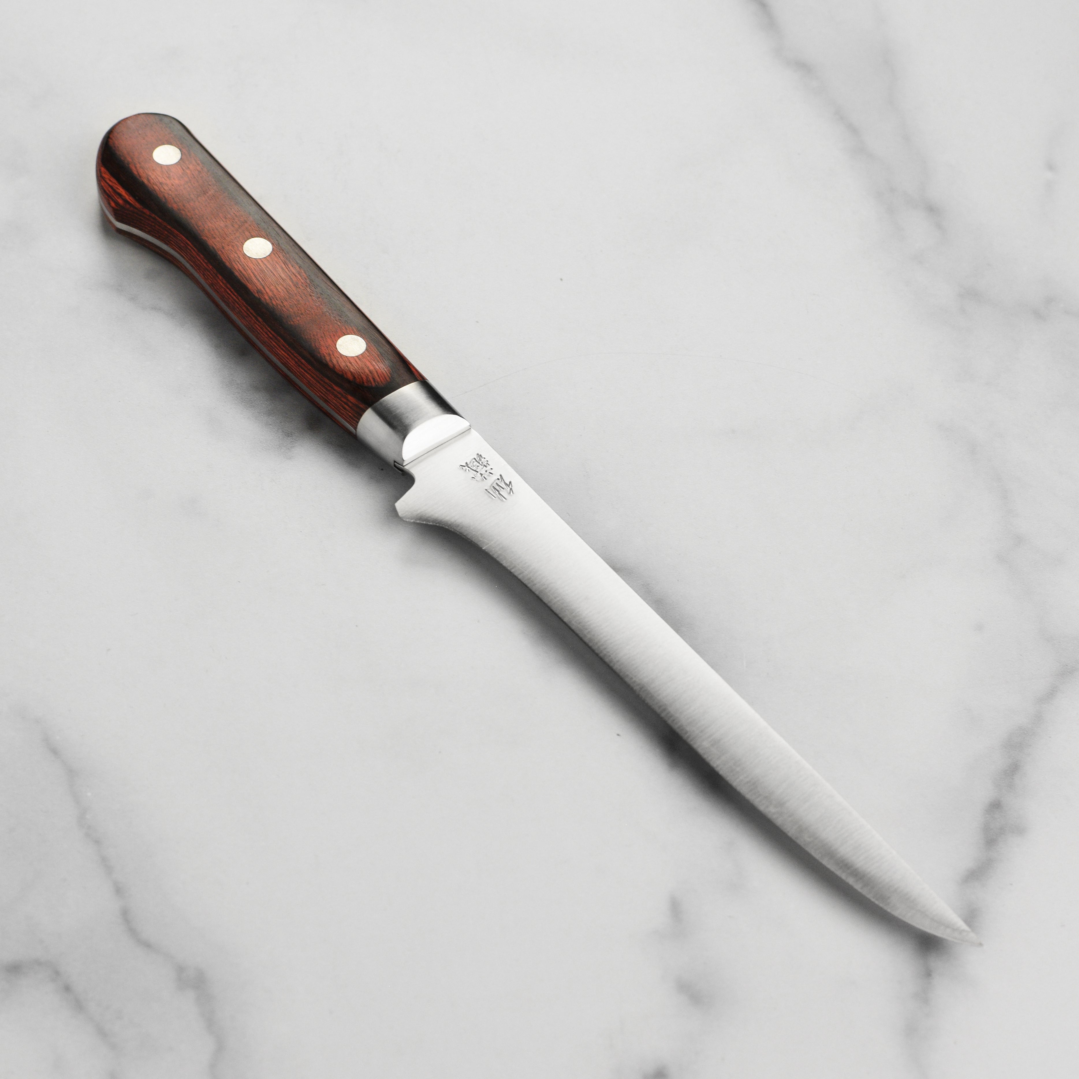 Senzo Clad AUS10 boning knife with sharp blade and Pakkawood handle for precise butchering