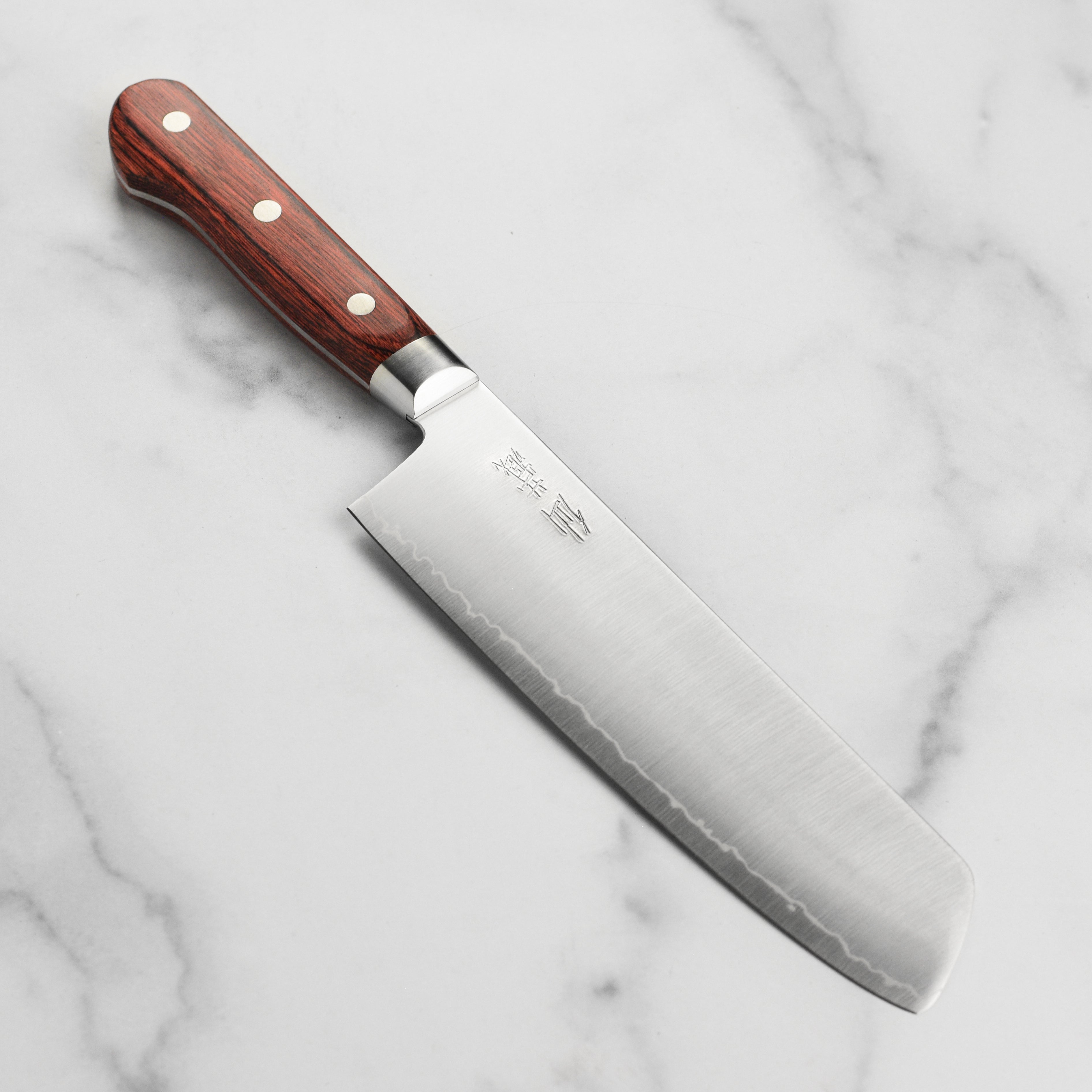Japanese Nakiri knife with Pakkawood handle for precise vegetable slicing