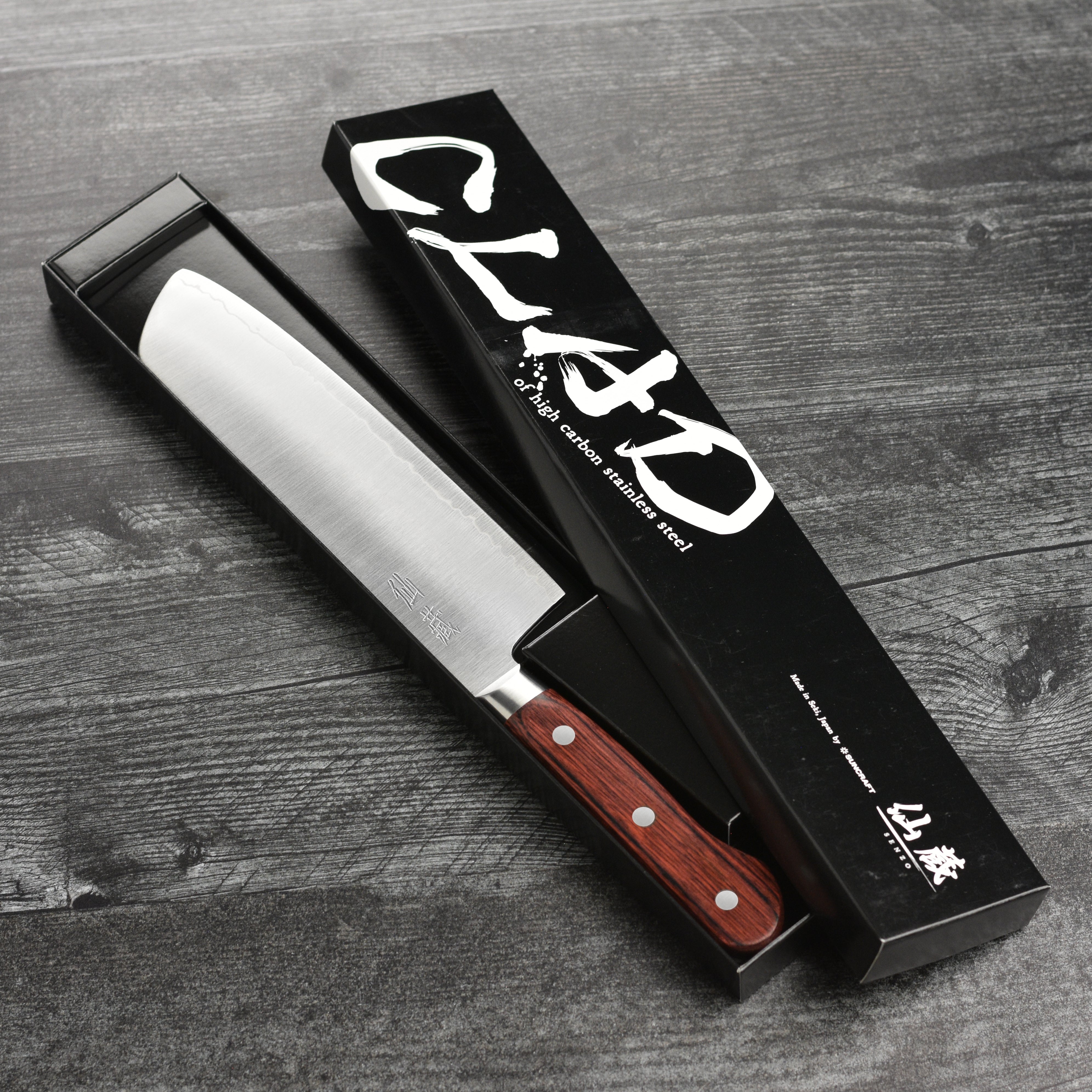 Close-up of the Senzo Clad Nakiri knifes blade and handle for kitchen use
