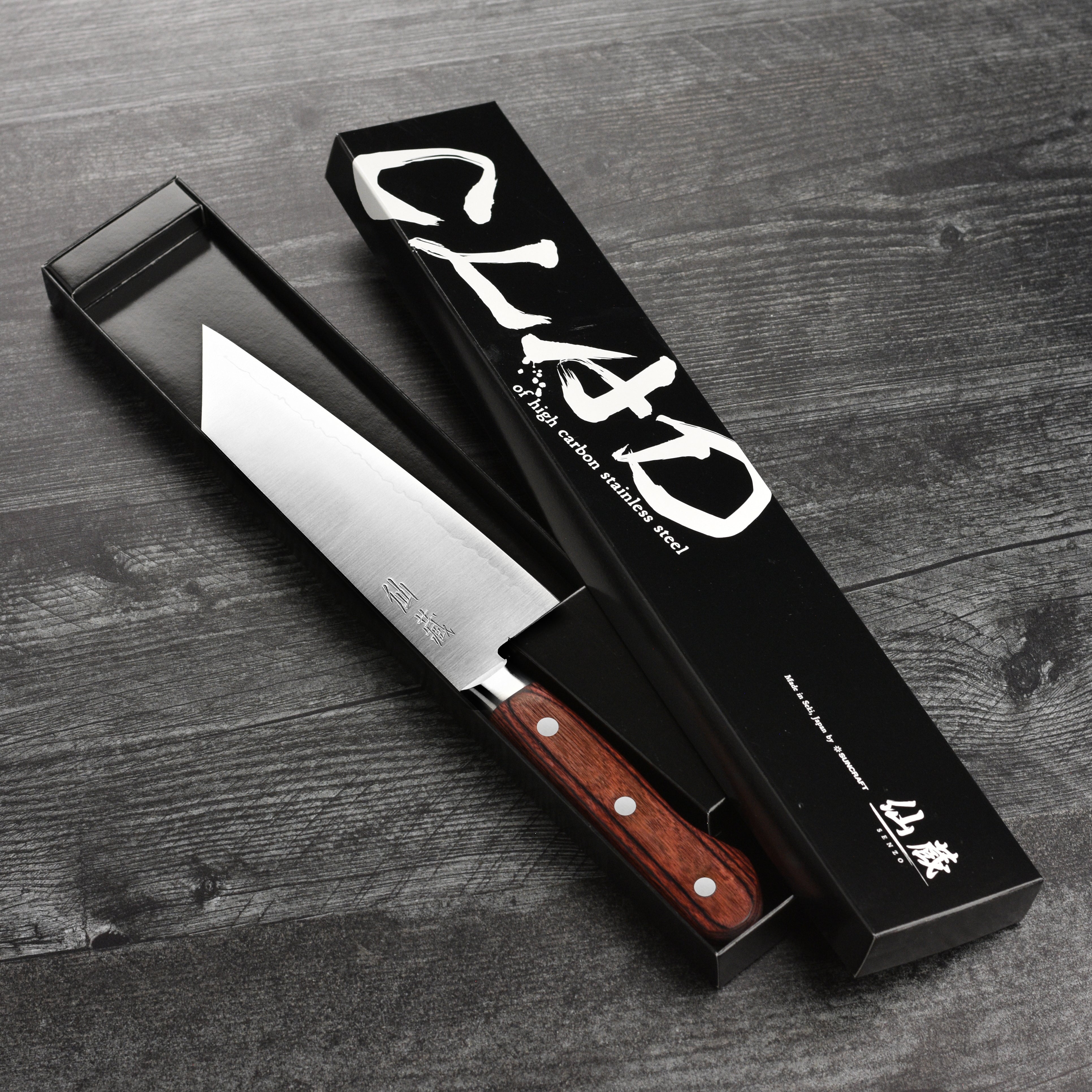Chef using the Bunka knife to chop vegetables, demonstrating its versatility and sharpness