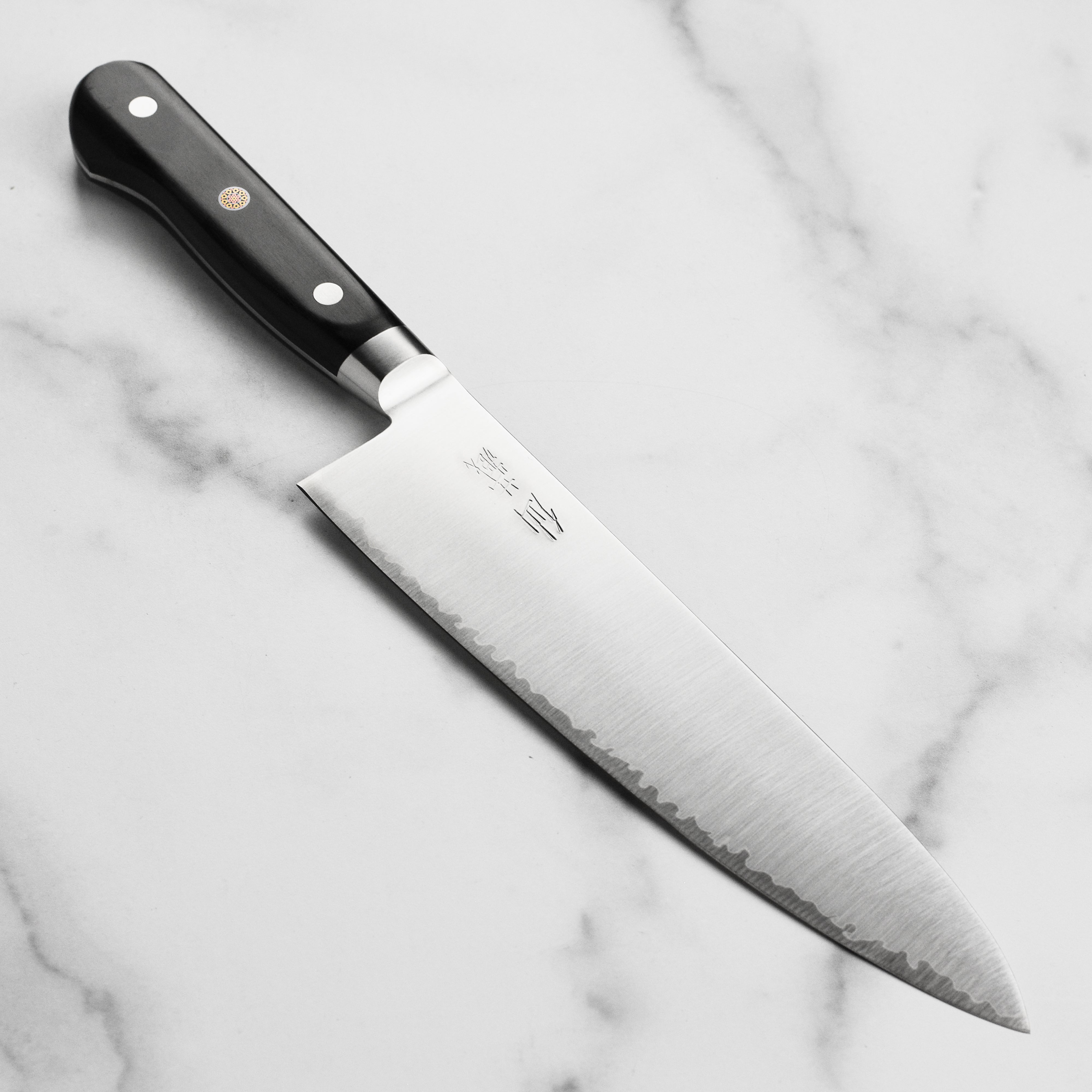 Suncraft Senzo Premium Japanese Chef's Knife showcasing its high-carbon stainless steel blade and elegant wooden handle.