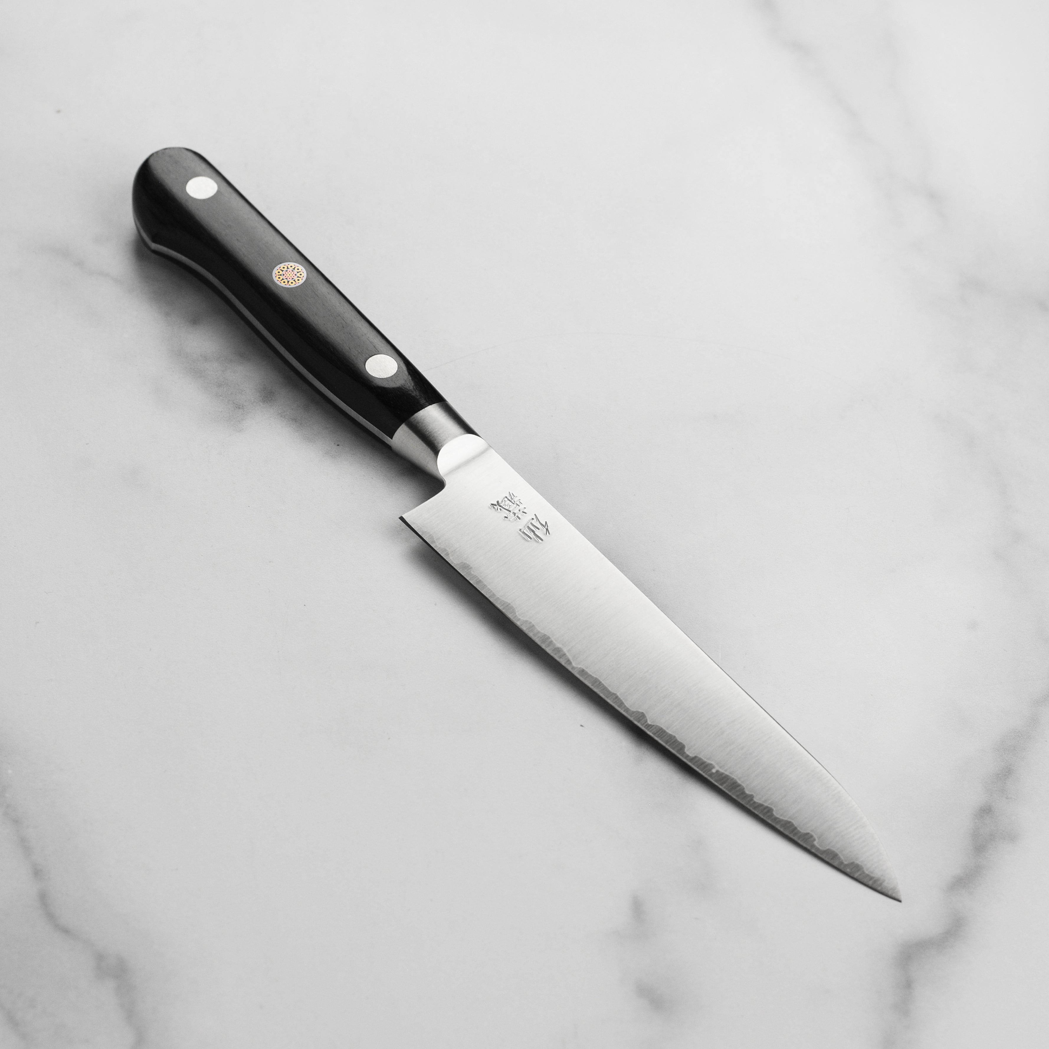 Senzo Artisan SG2 Utility Knife showcasing the high-carbon blade and ergonomic handle.