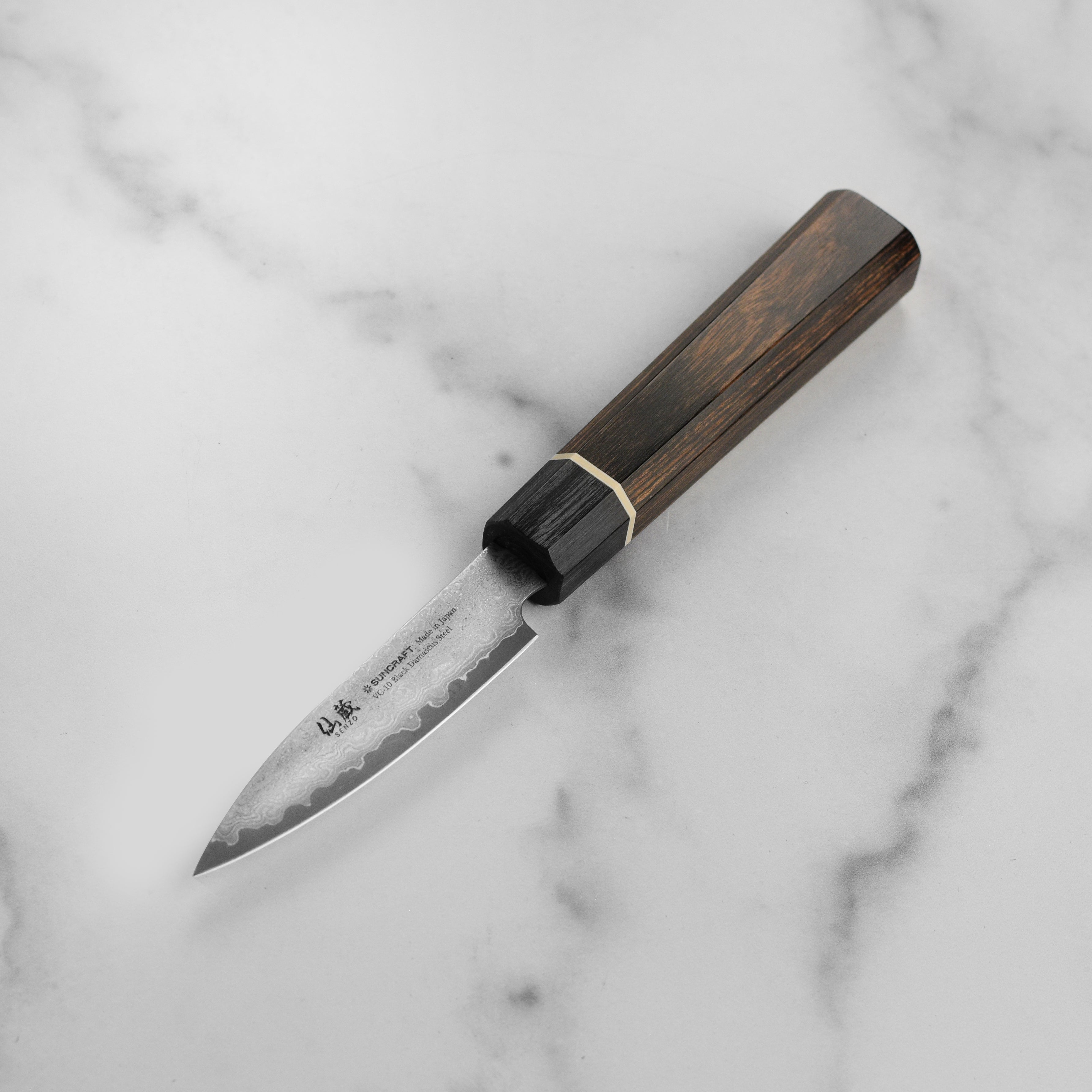 Side view of the Senzo Elite VG10 Damascus paring knife displaying its Pakkawood handle and blade.