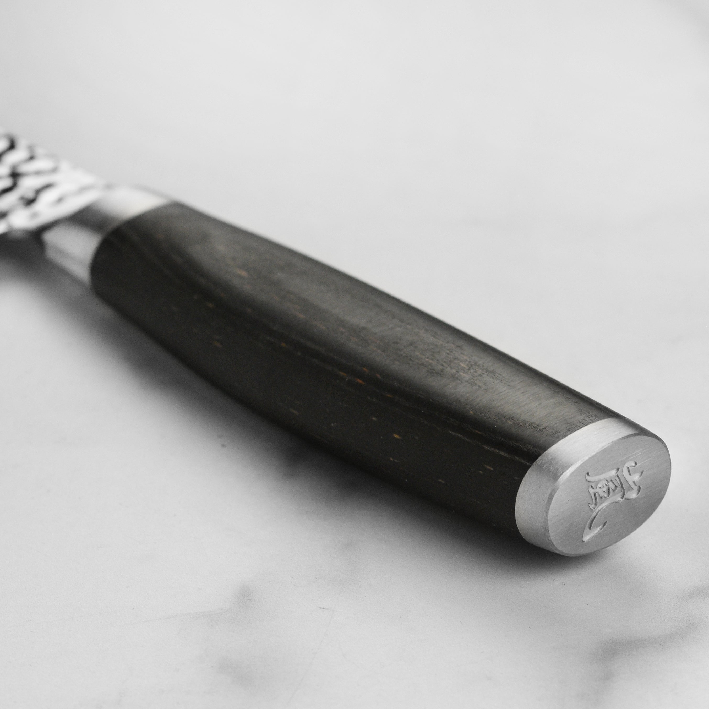 Yaxell Taishi Kiritsuke Knife in use, demonstrating precision cutting on fresh vegetables.
