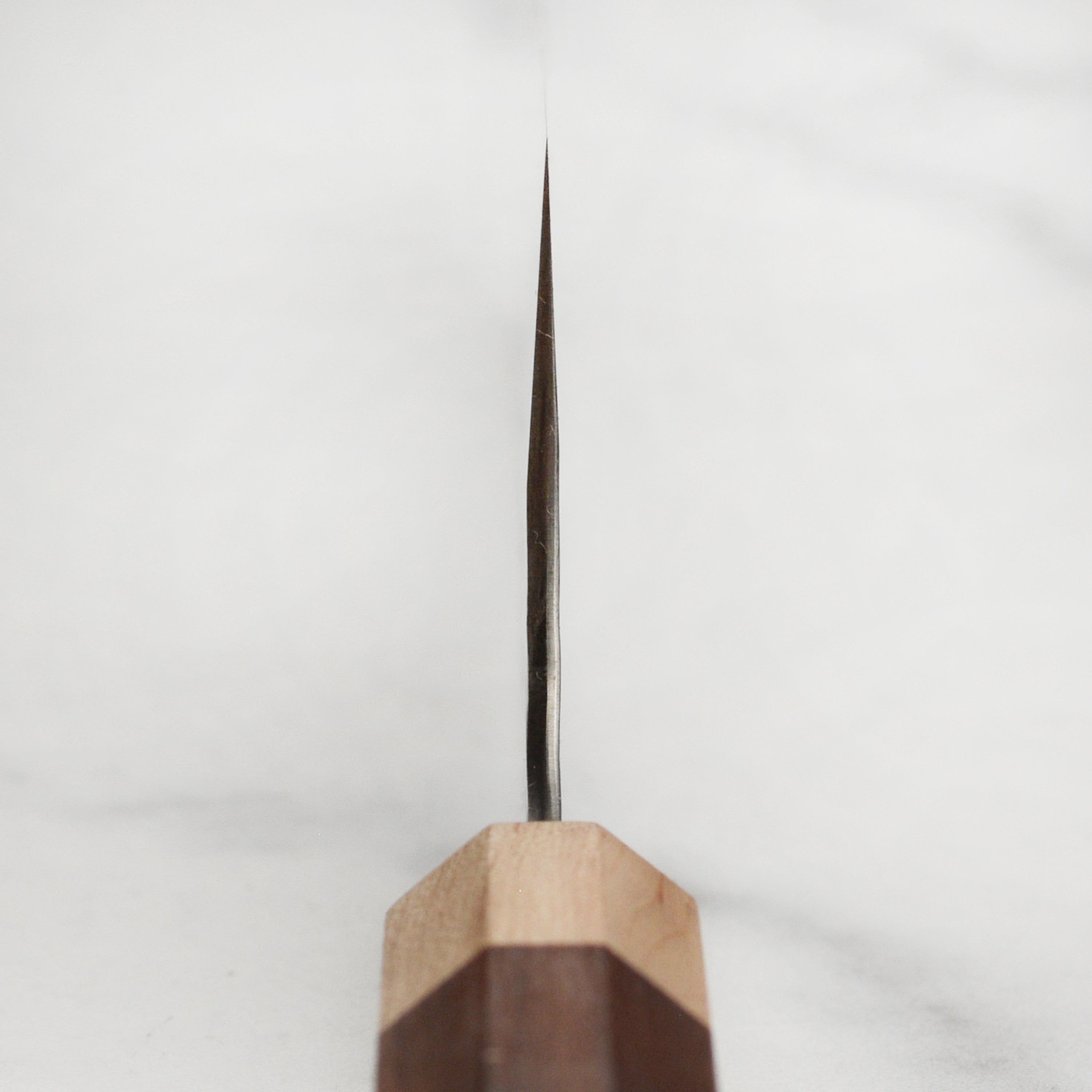 Kurosaki Senko Ei SG2 Gyuto Knife showcasing its polished blade and textured surface.