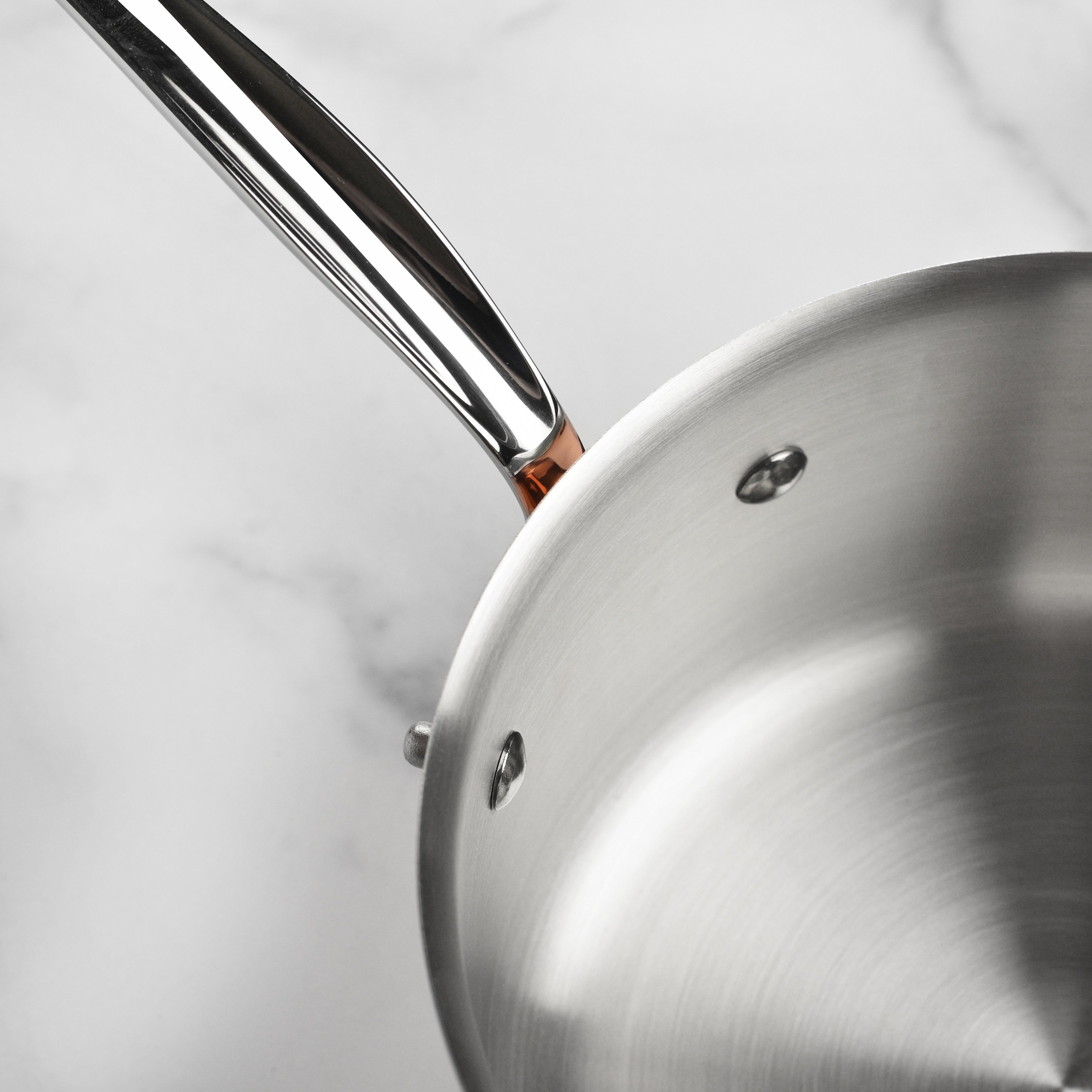 Mauviel copper saucepan with lid on induction stove