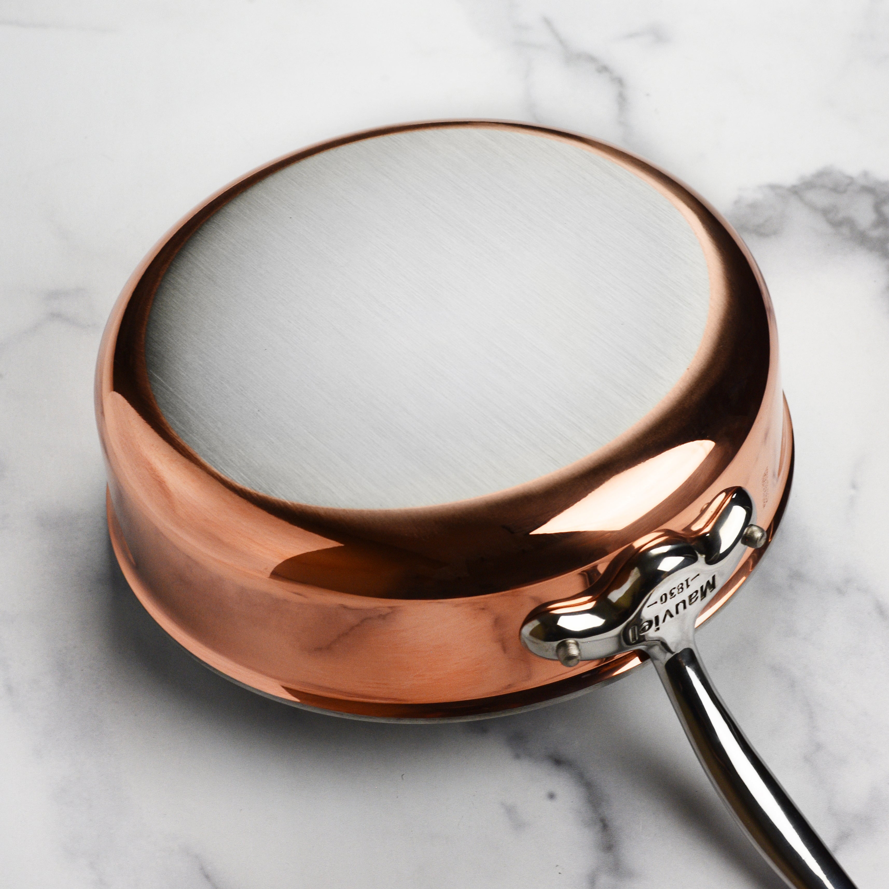 Mauviel M6S copper cookware with lid placed on kitchen countertop