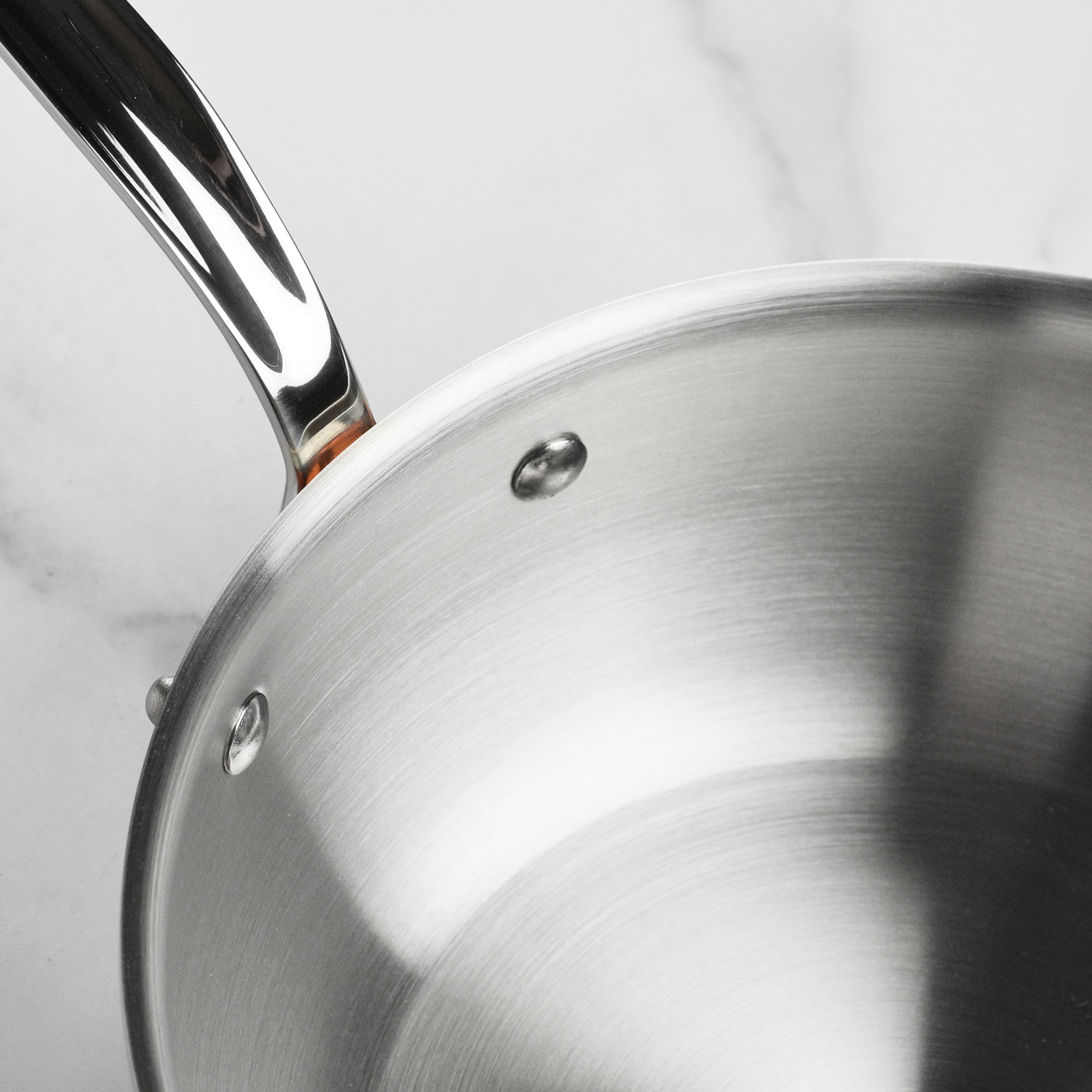 Mauviel M6S 3.4-quart copper sauté pan showcasing its elegant design and sturdy handle.