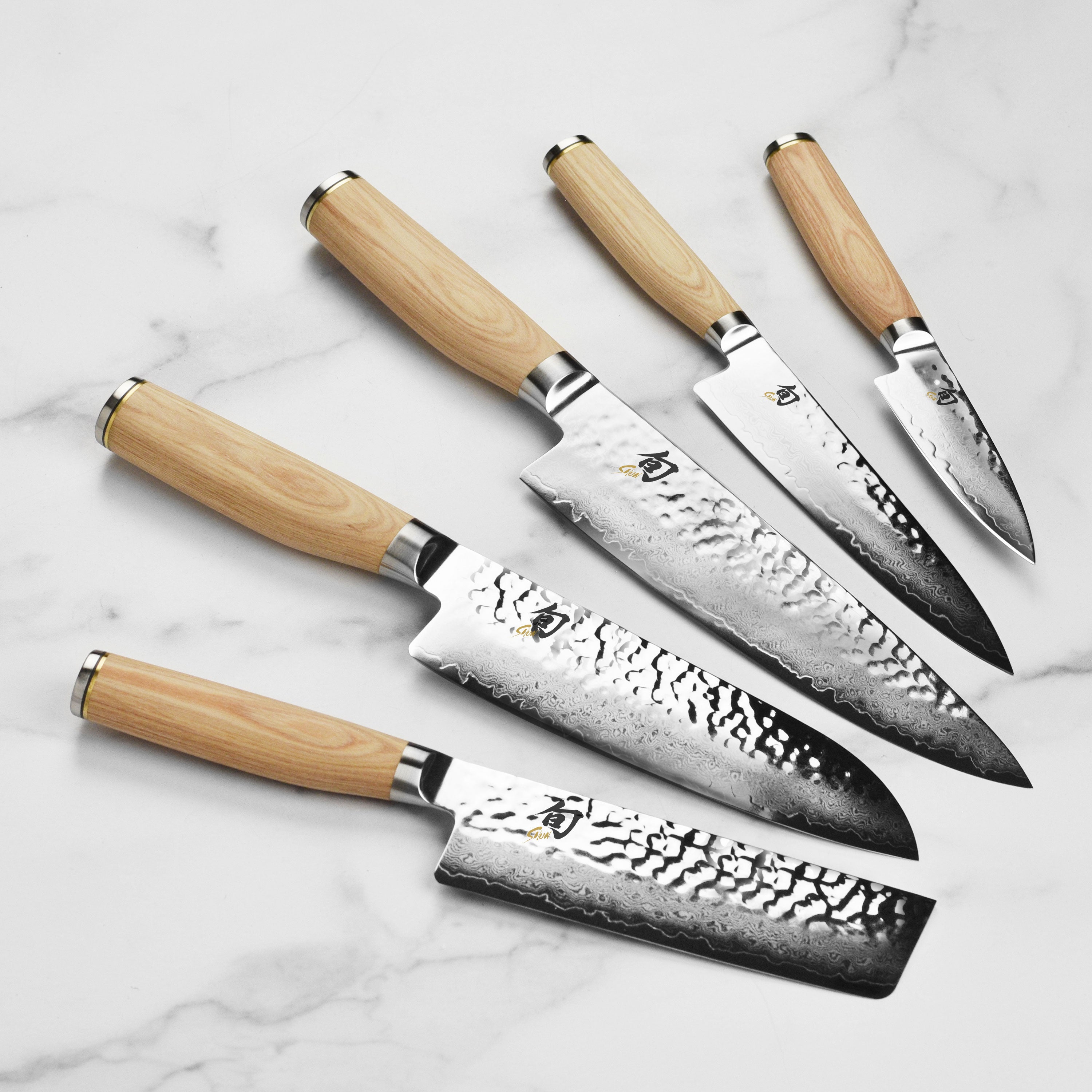 Chef slicing vegetables using the Shun Premier Blonde kitchen knives