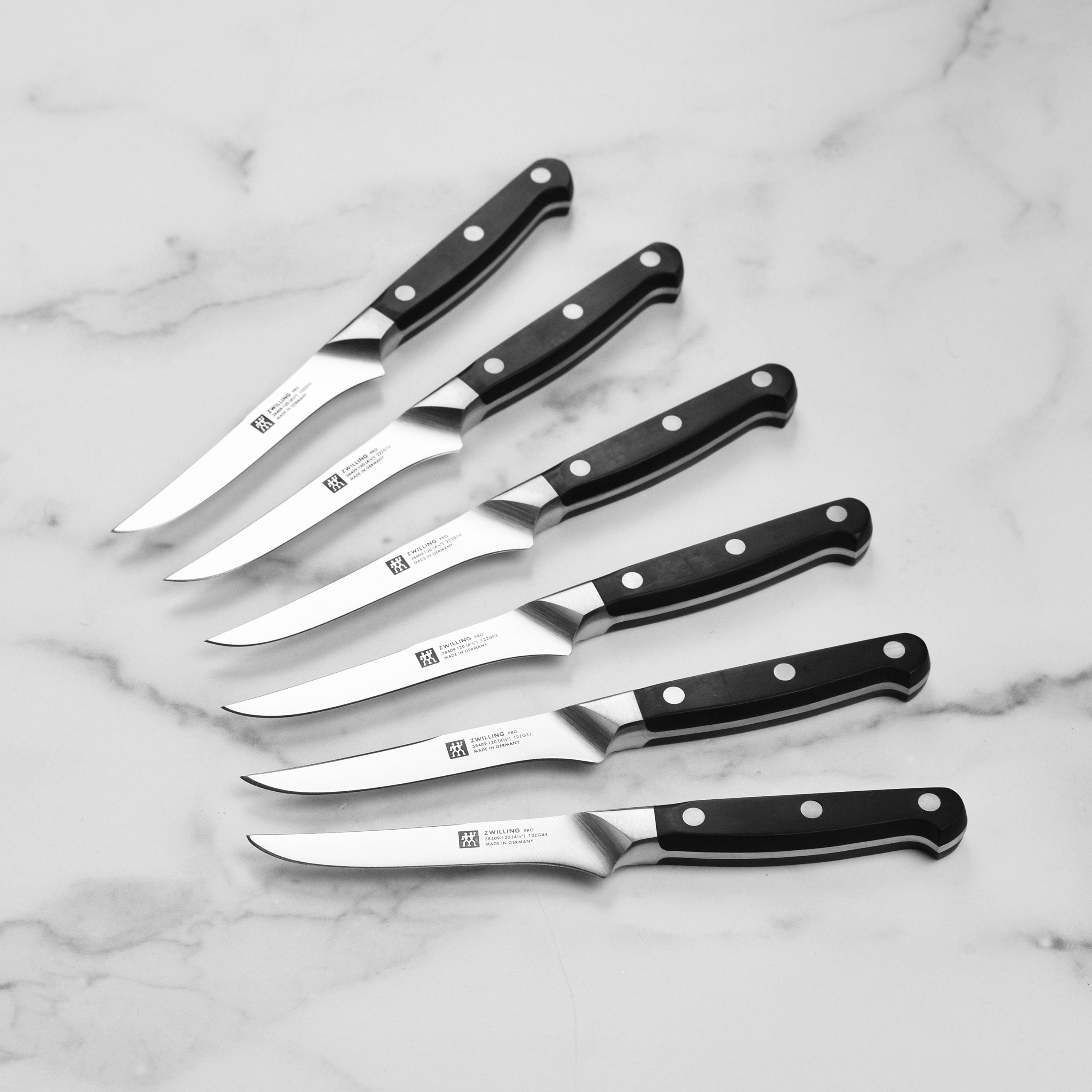 Chef using Zwilling knives from the knife block set to prepare ingredients