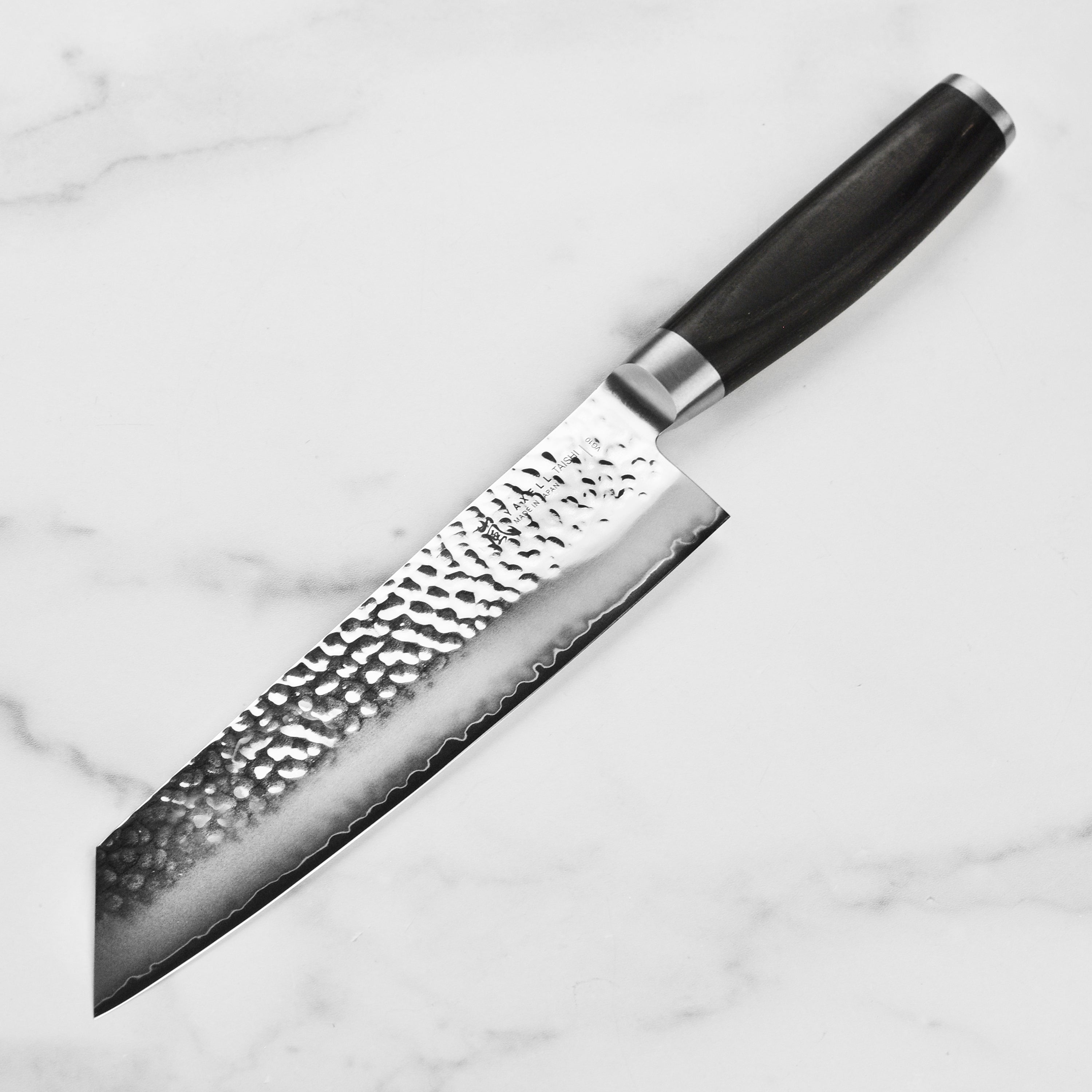 Yaxell Taishi Kiritsuke Knife in use, demonstrating precision cutting on fresh vegetables.