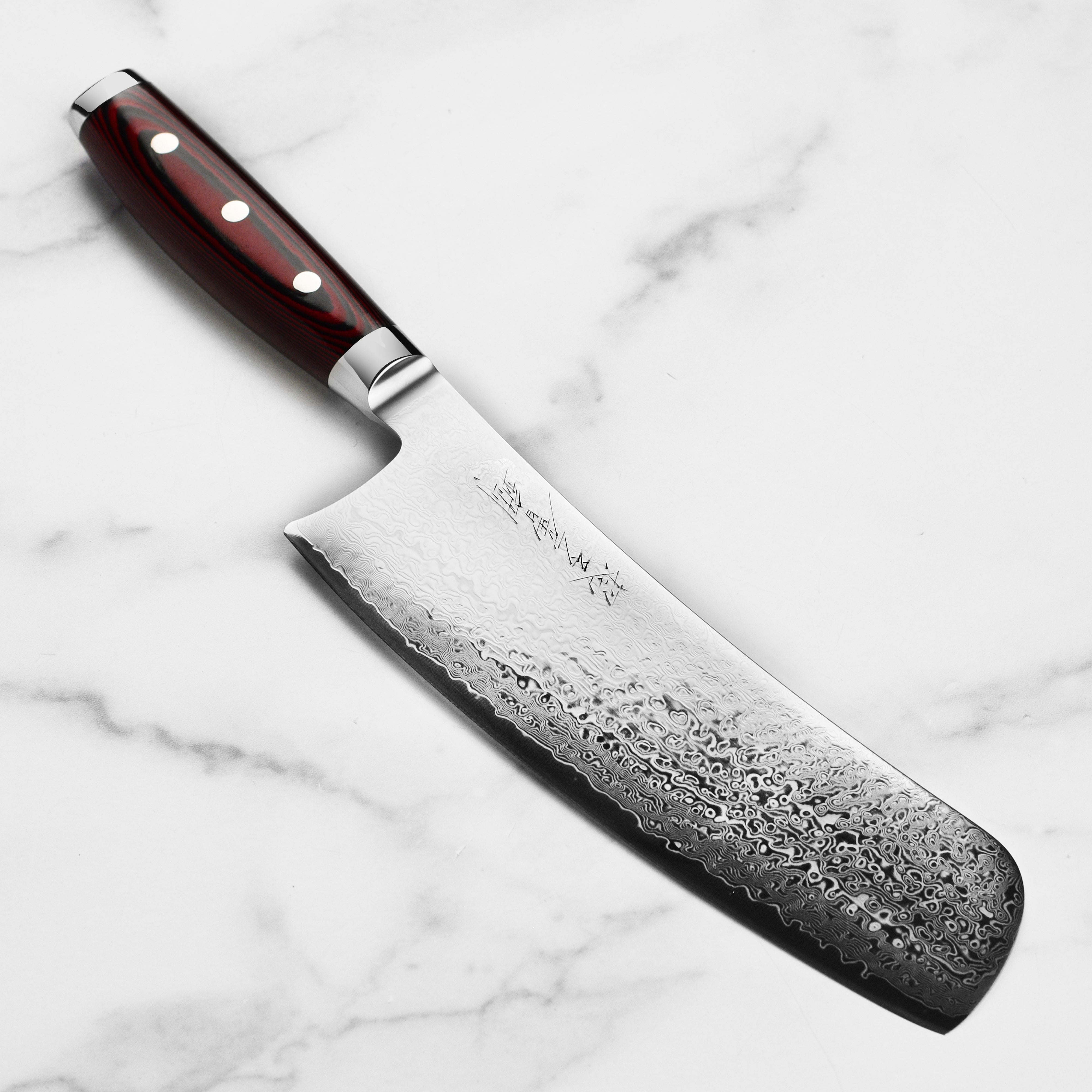 Yaxell Konata SG2 Chef Knife from a side angle, highlighting the blade's detail and design.