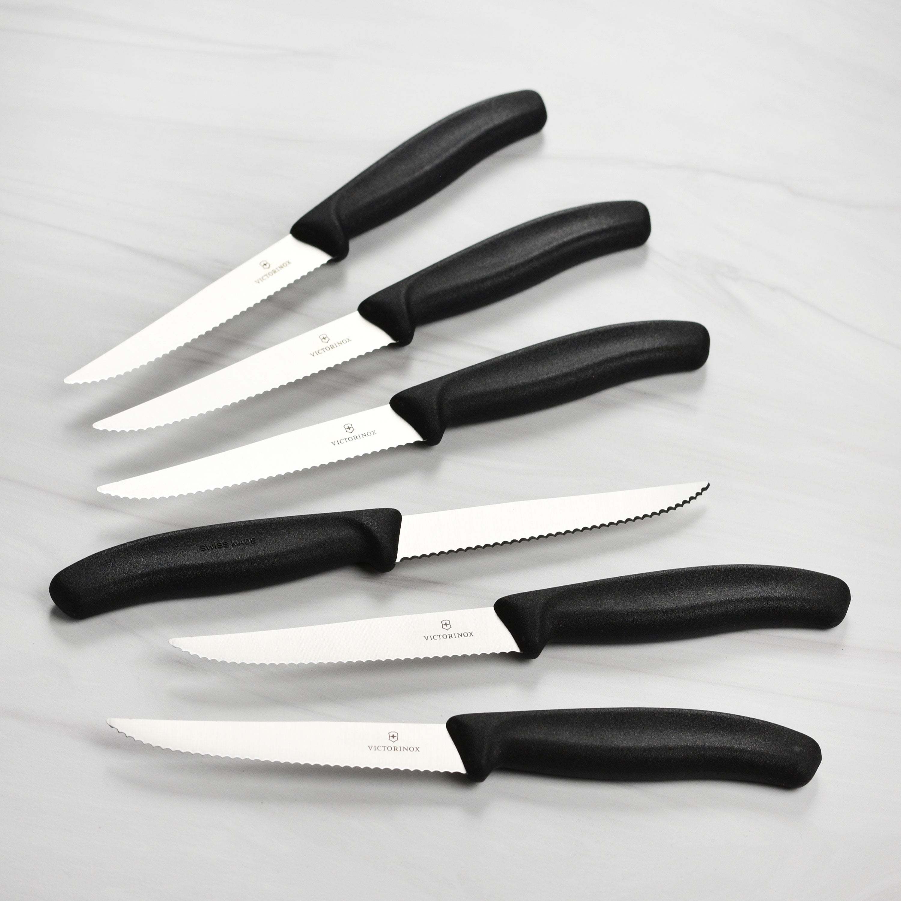 Set of knives in a modern knife block with ergonomic handles
