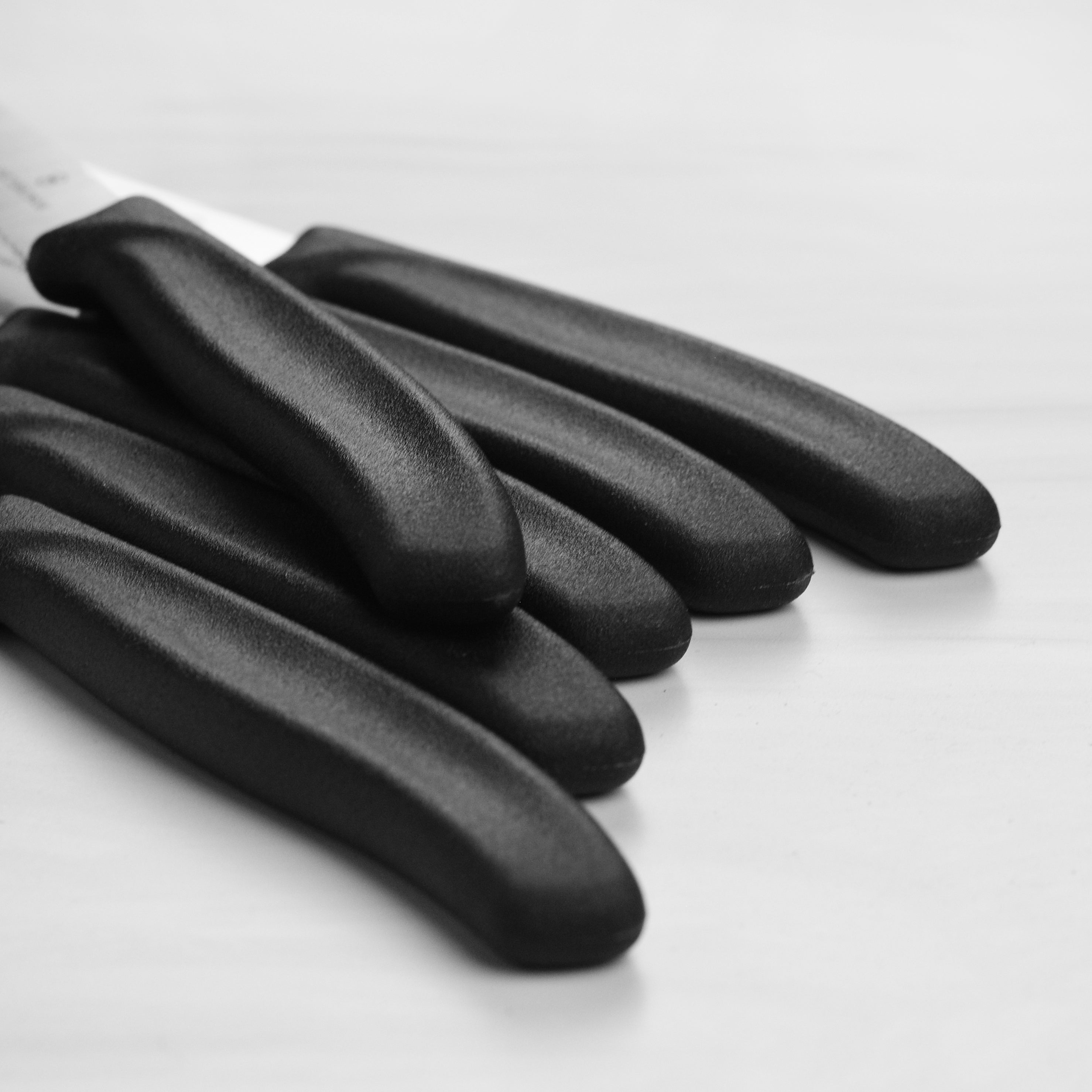 Side view of the full 6-piece cutlery set arranged neatly on a wooden dining table—ideal for home use.