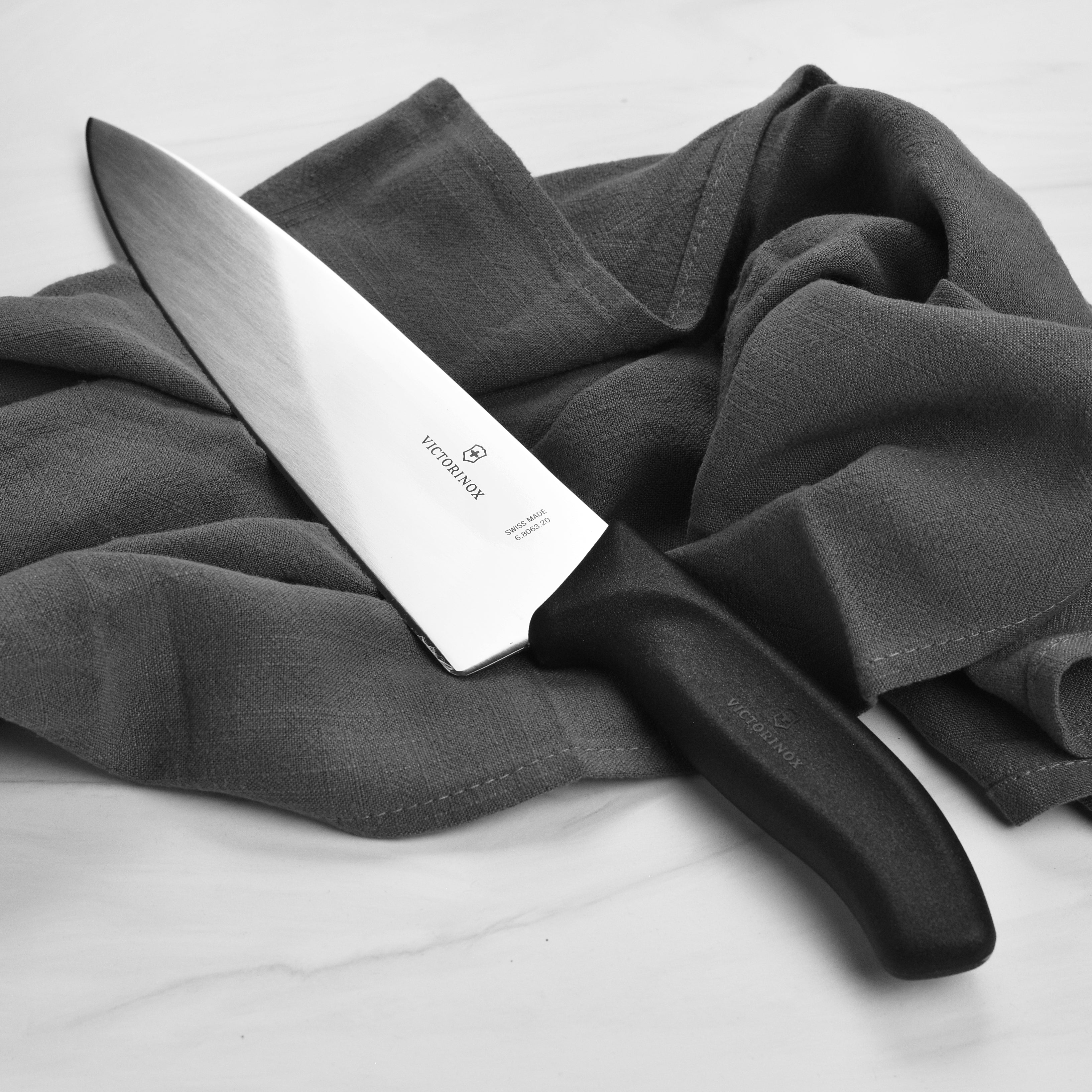 Close-up of the Fibrox handle on the Swiss Precision Chefs Knife for enhanced grip.