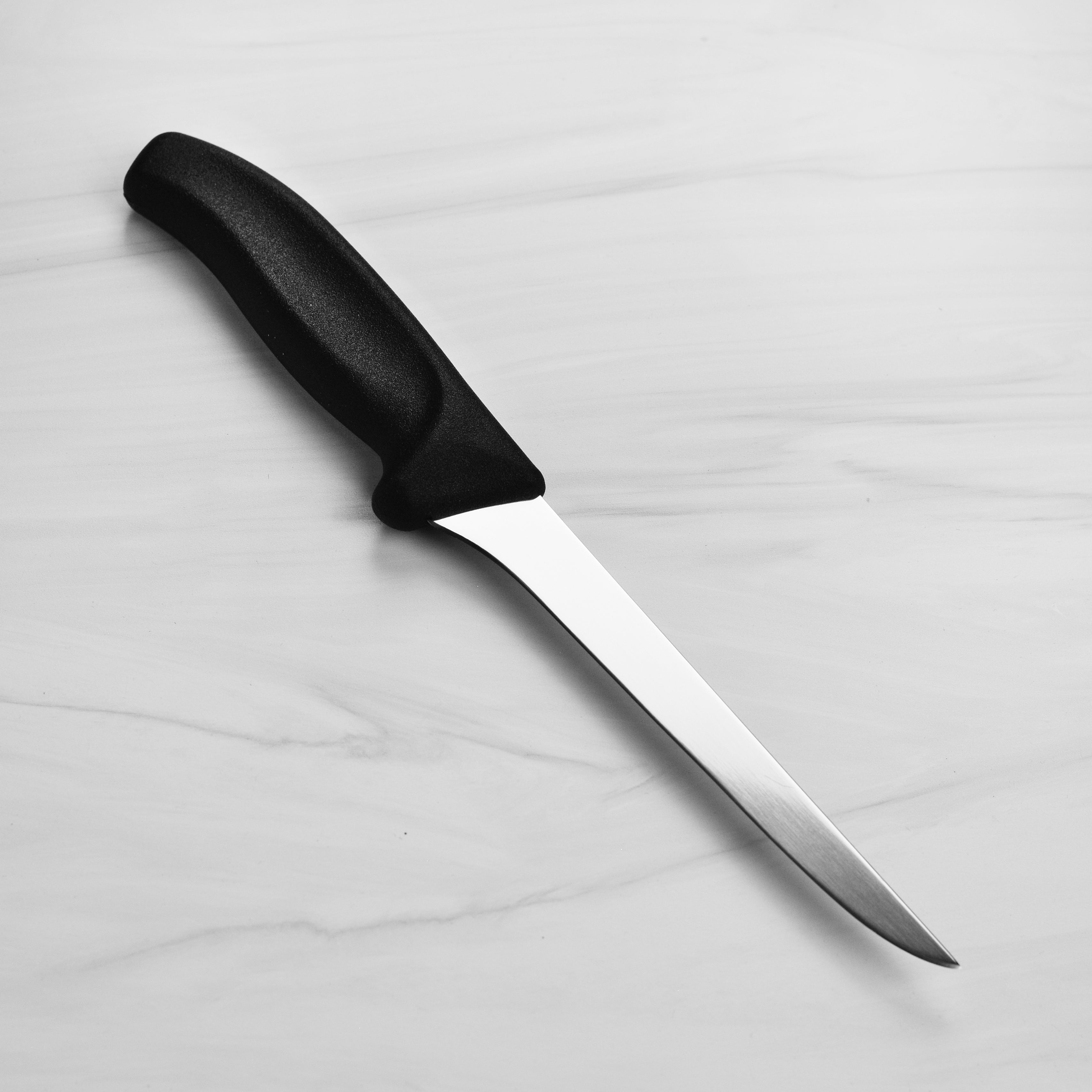 Close-up of the slip-resistant Fibrox handle on a Swiss boning knife