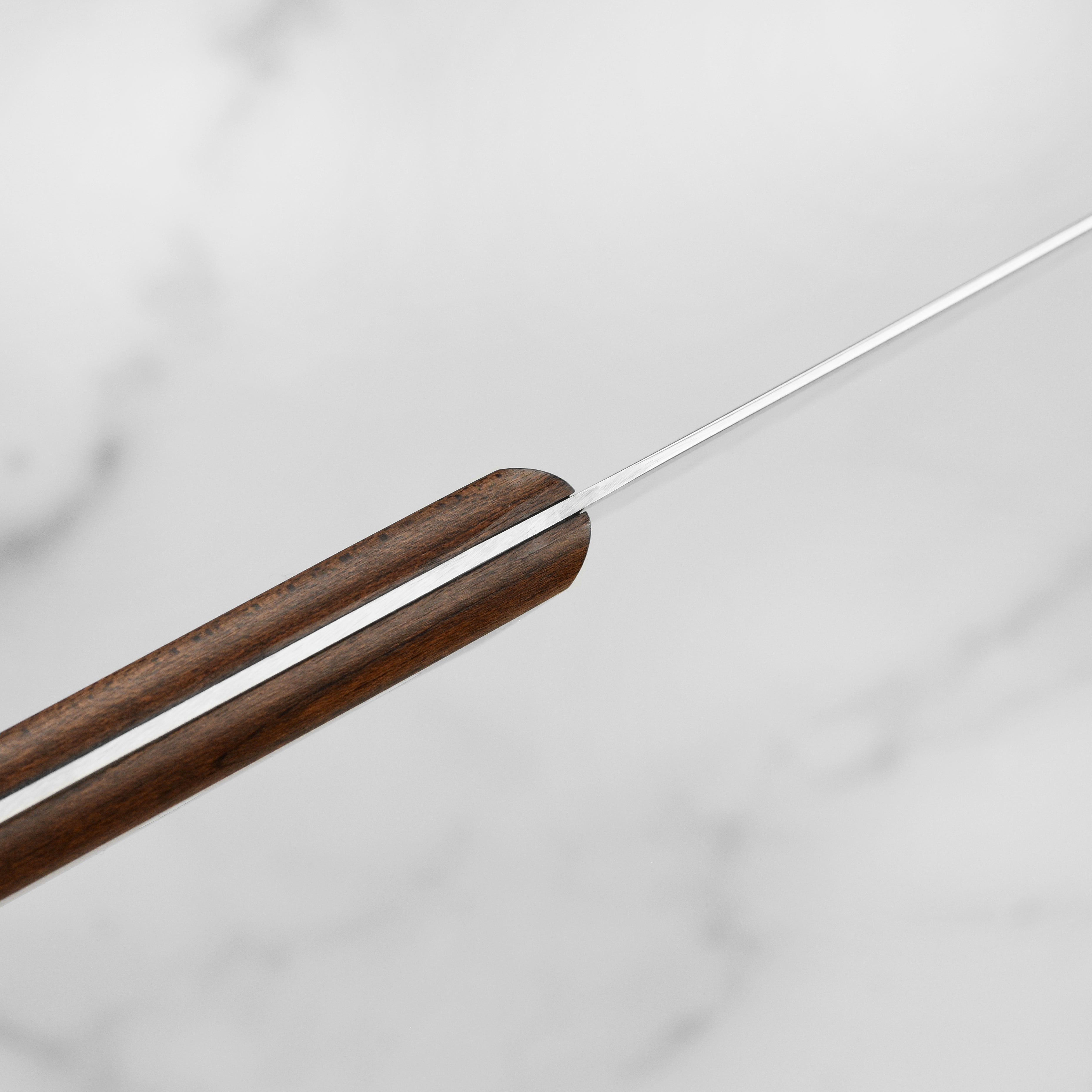 Elegant and modern Victorinox steak knives with wood handles, perfect for gourmet dining.