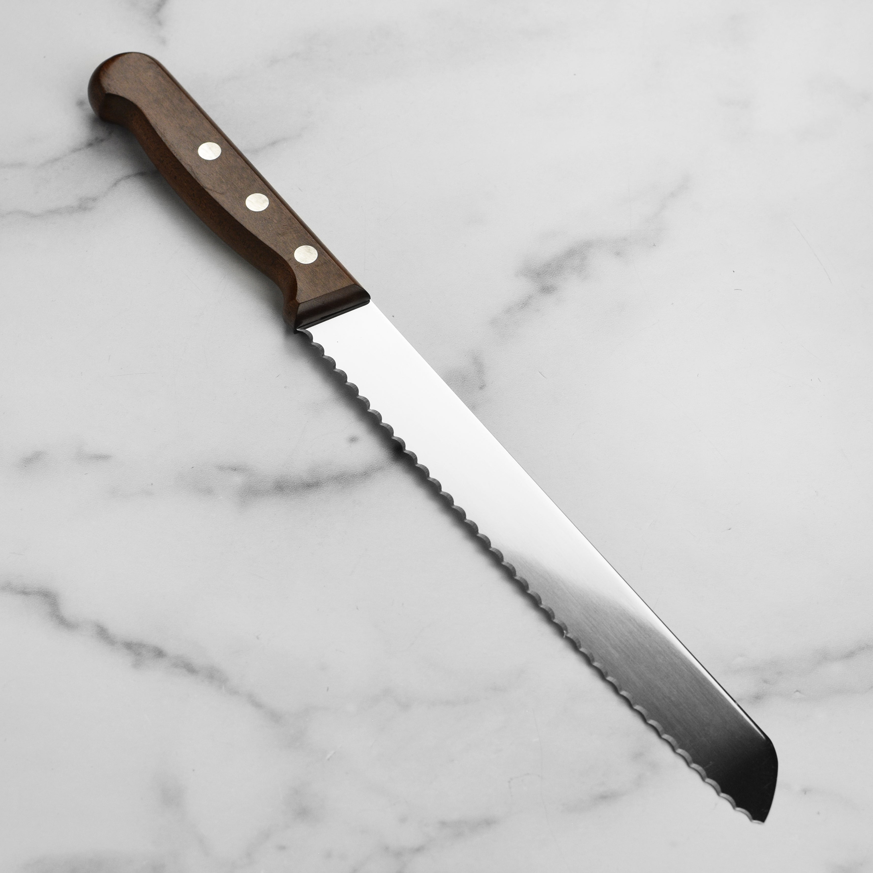 Close-up of Victorinox 8-inch bread knife showing tapered blade edge
