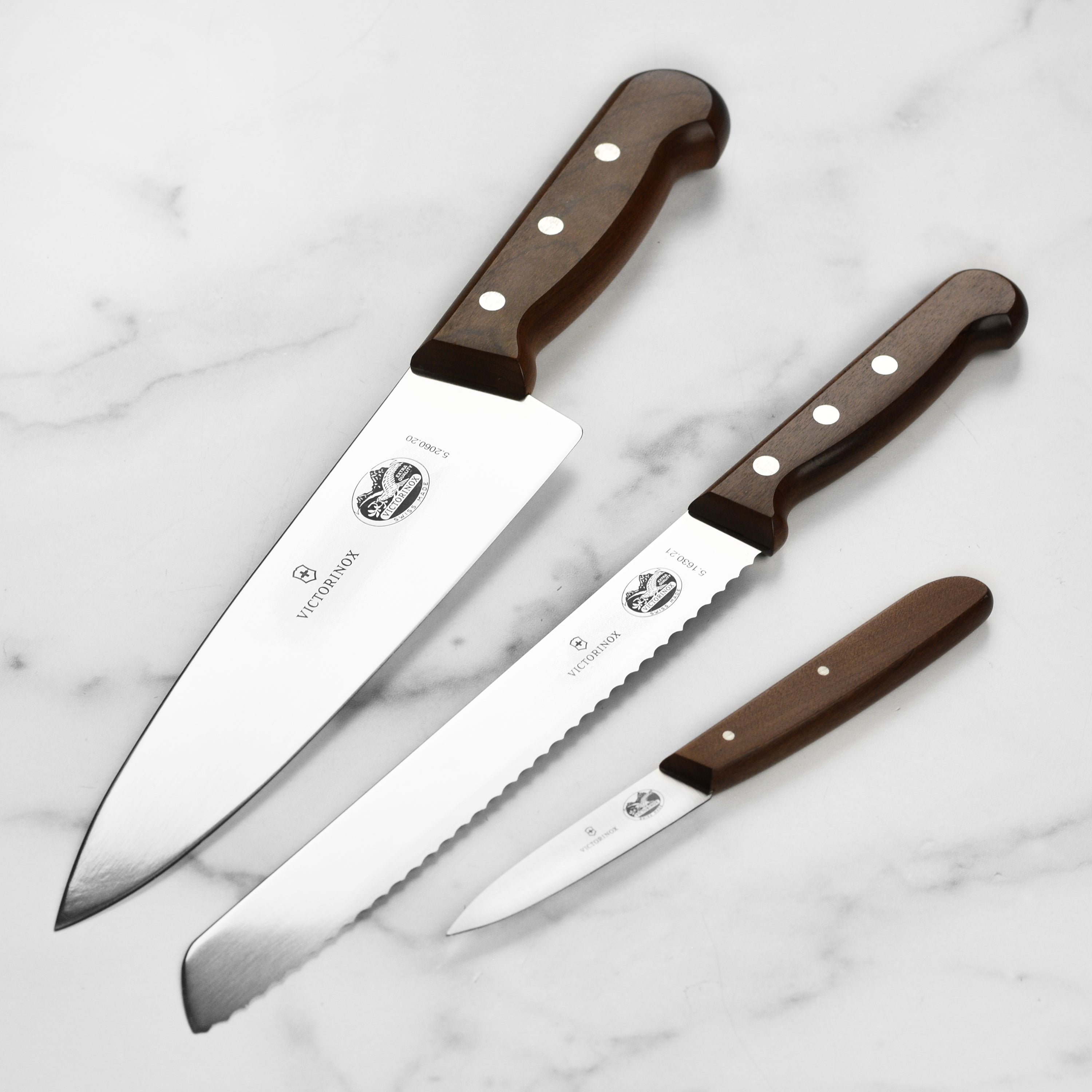 Close-up of the Swiss Precision Wood Knife Set showcasing high-carbon stainless steel blades.