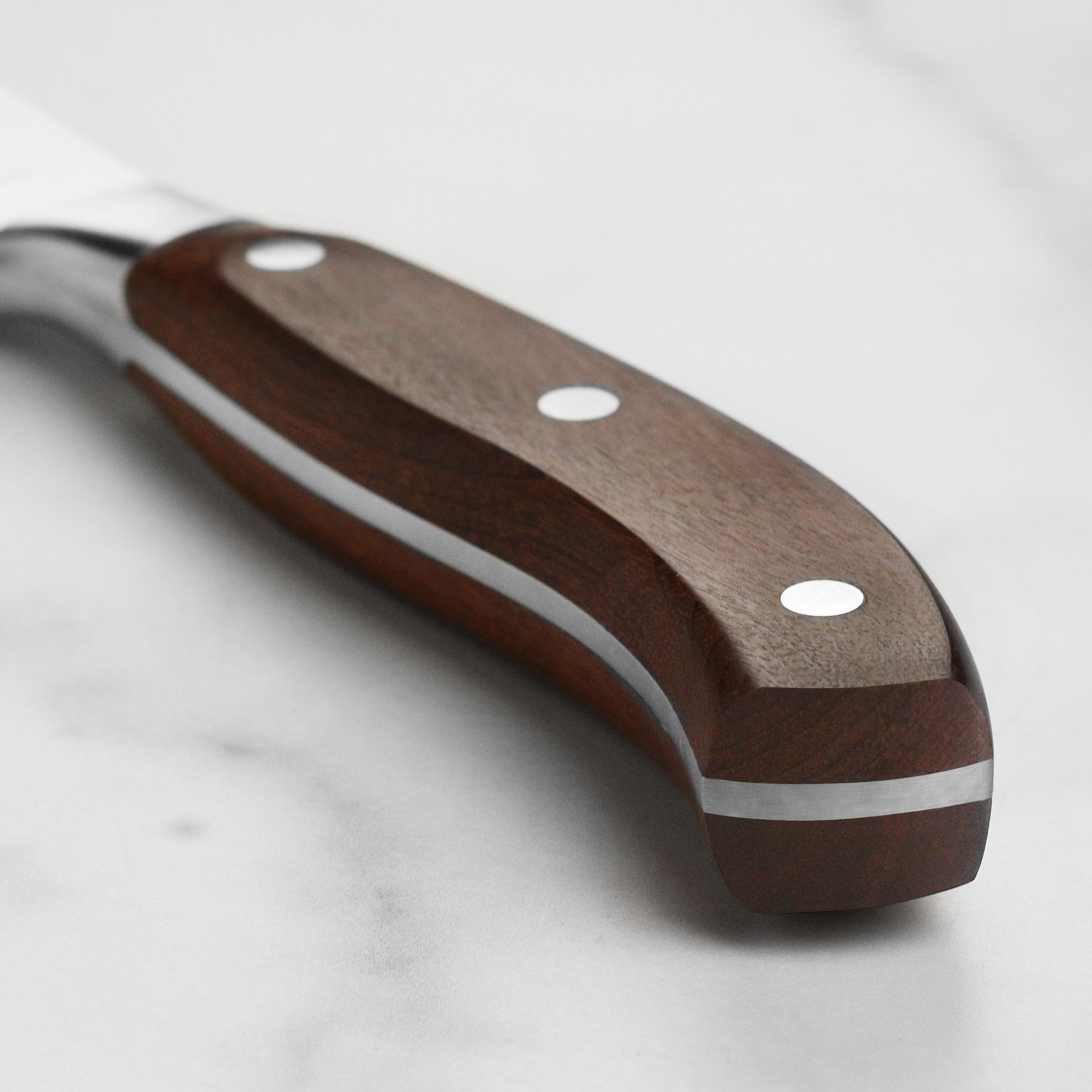 Professional chef using the Victorinox German chef knife for slicing vegetables