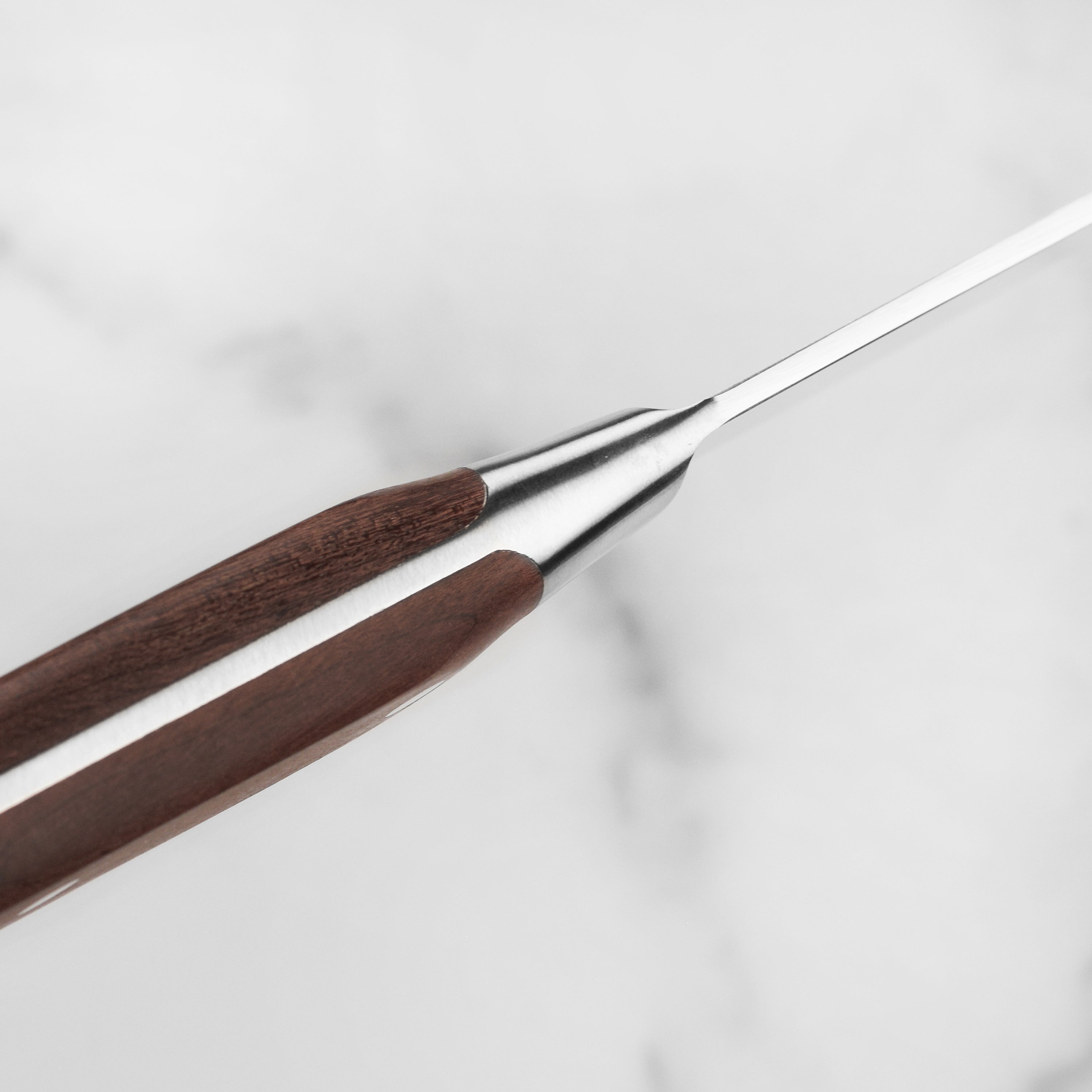 Maple wood handle detail shot showing ergonomic design and rivets