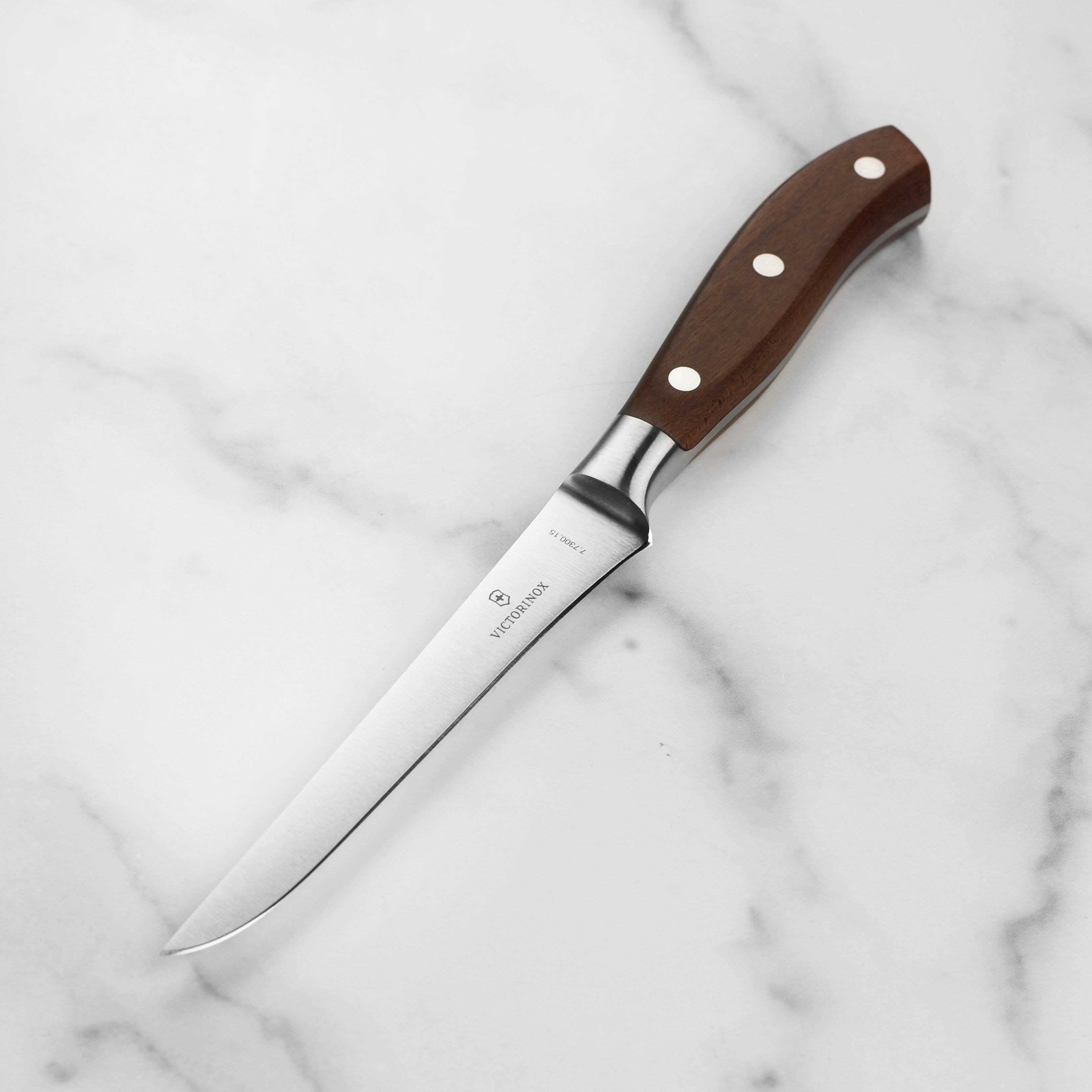 Close-up of Victorinox boning knife blade showing sharp edge and high-carbon steel quality