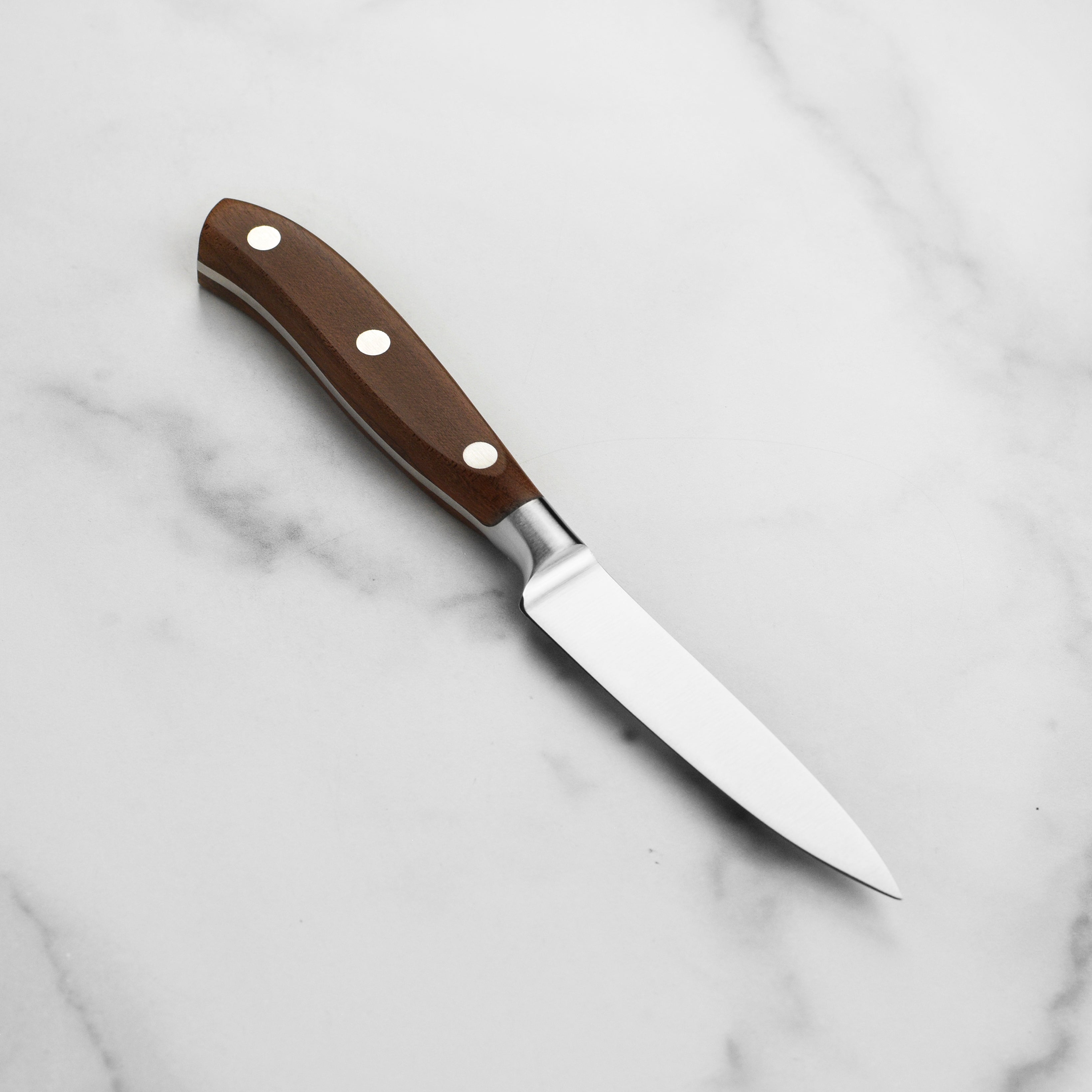 Maple wood handle detail shot showing ergonomic design and rivets