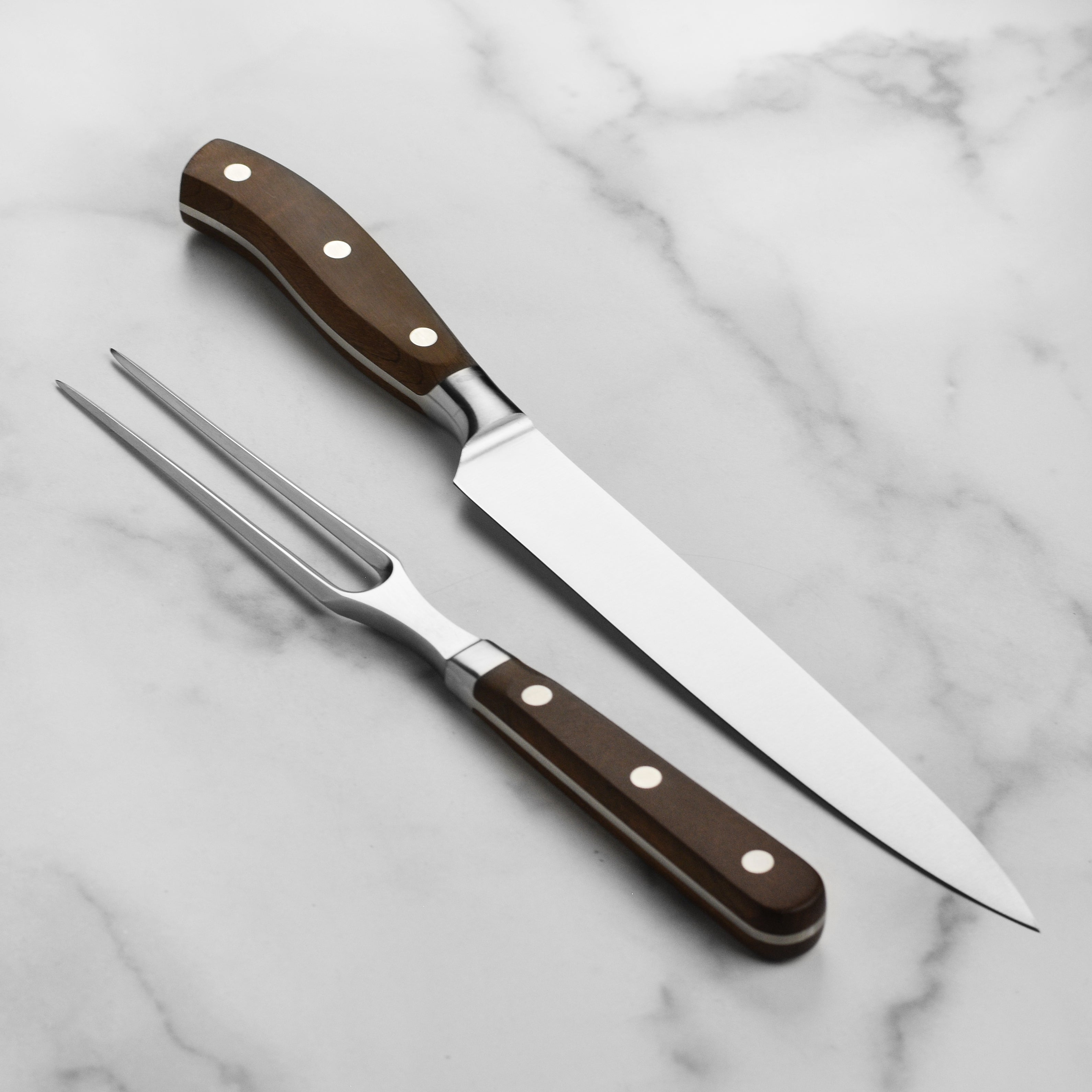 Victorinox Grand Maitre carving set displayed on a kitchen counter, ready for use.