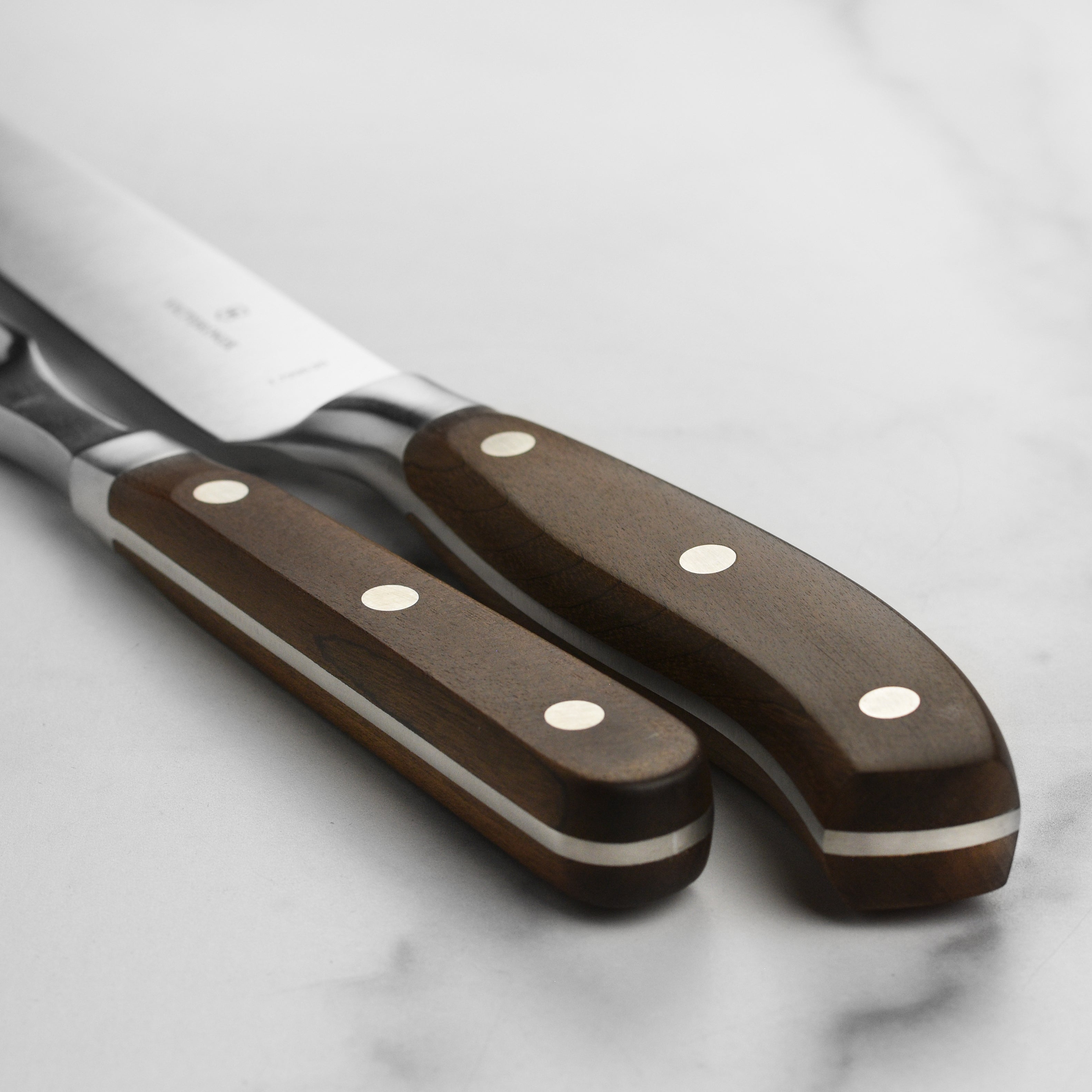 Close-up of Victorinox Grand Maitre meat carving knife, showcasing its sharp blade.