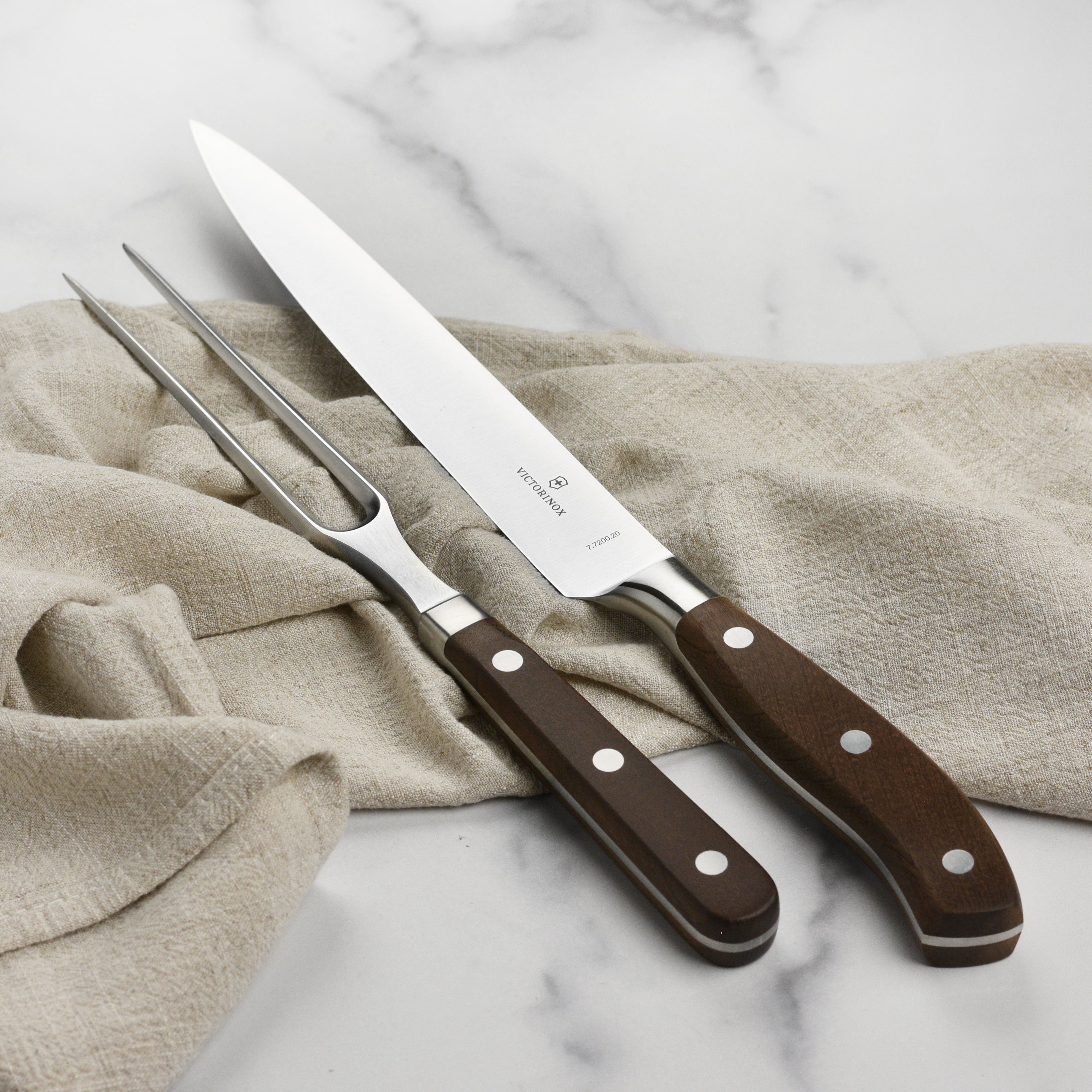 Close-up of Victorinox Grand Maitre meat carving knife, showcasing its sharp blade.