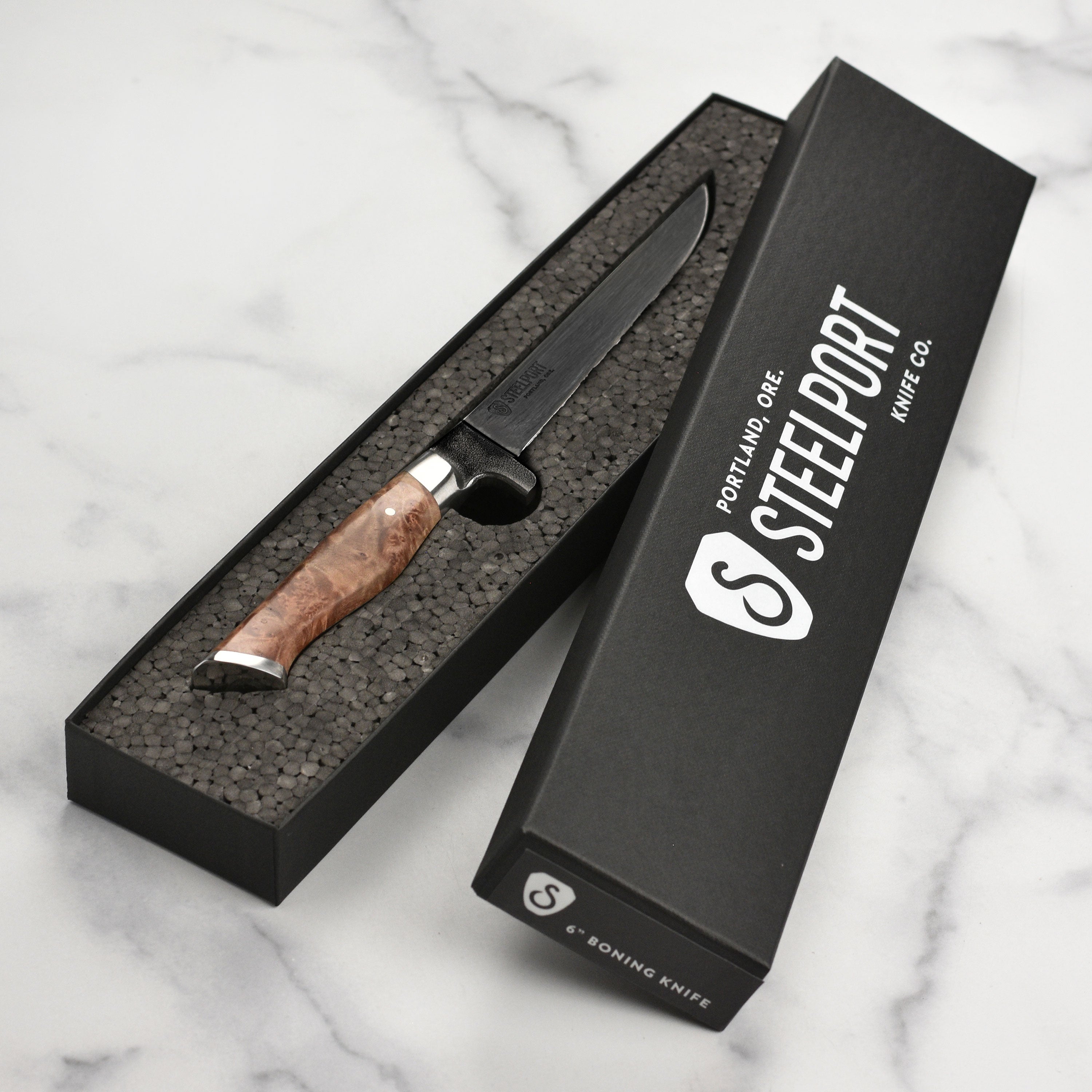 Close-up of Steelport 6" boning knife blade highlighting its sharpness and craftsmanship.