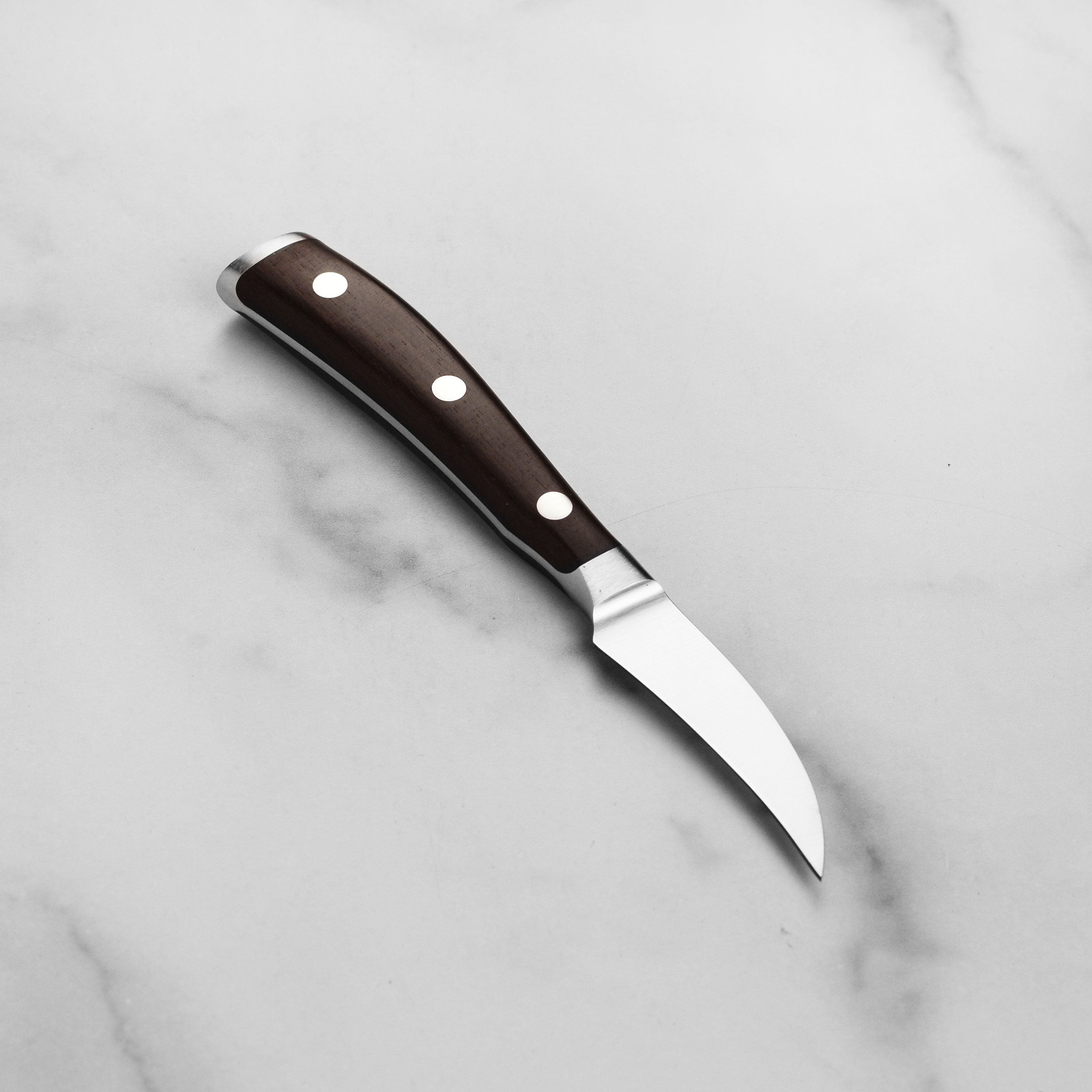 Peeling fruits with the Wusthof Ikon Blackwood kitchen knife