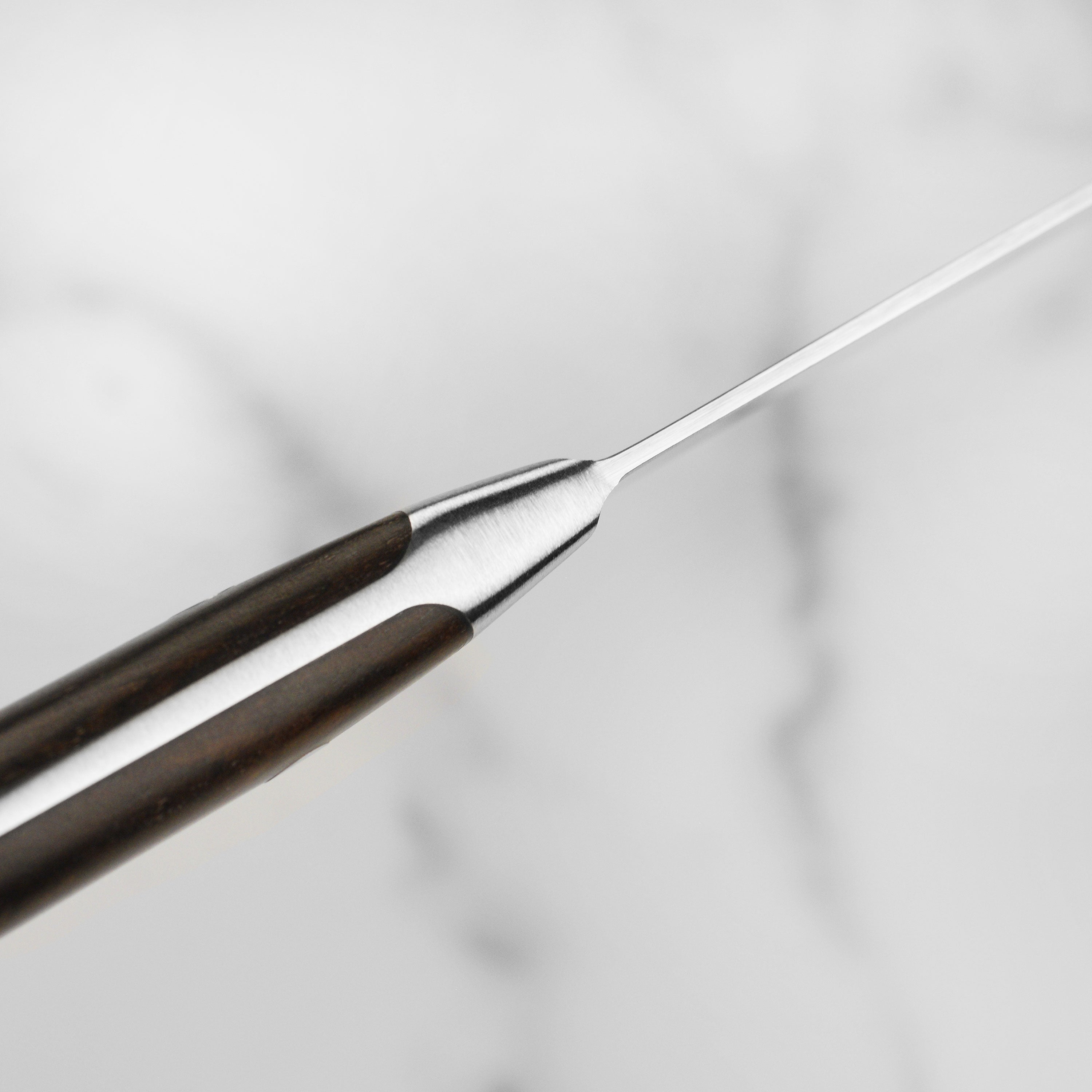 Detailed view of the 8-inch high-carbon stainless steel blade