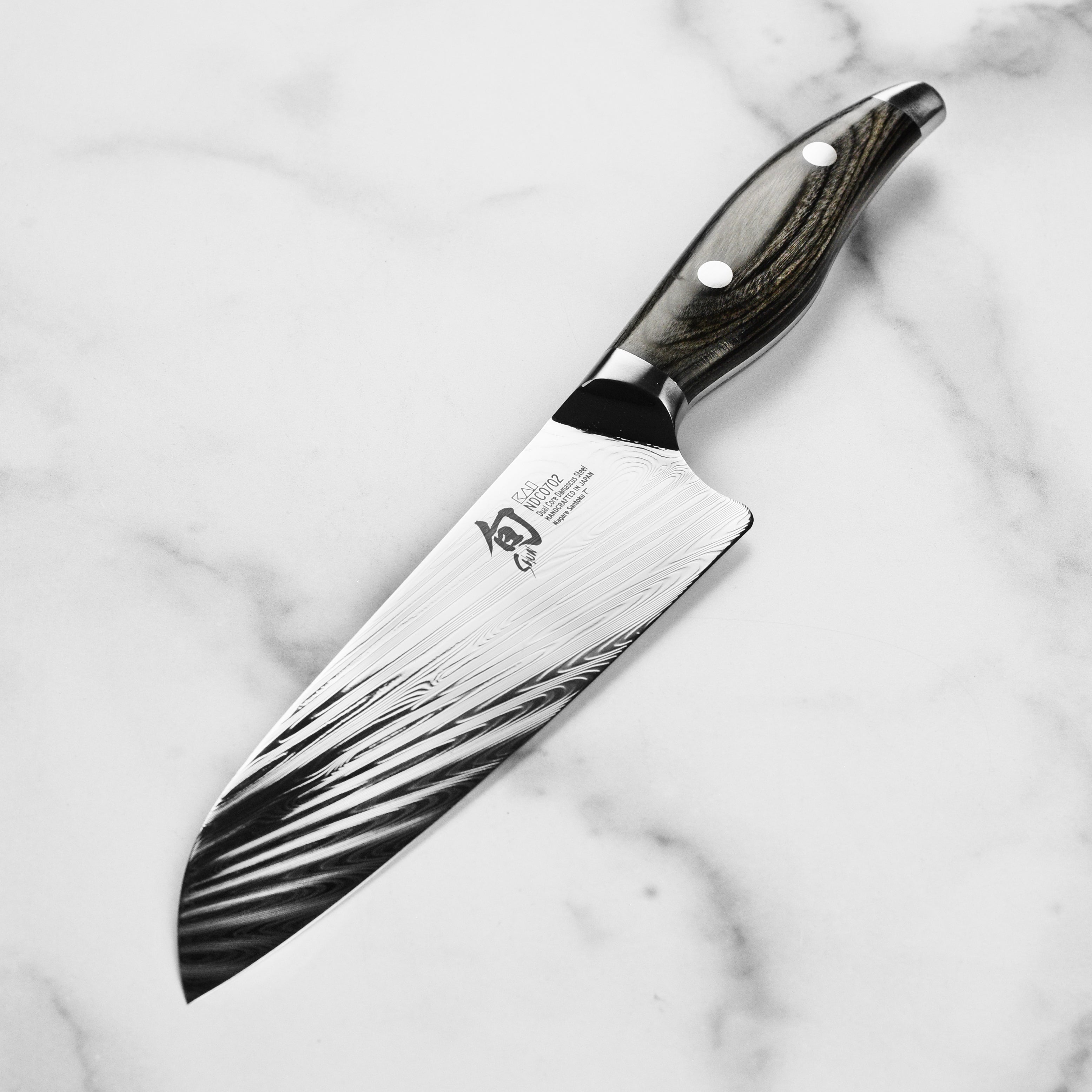 Japanese chef knife with Damascus layers, ideal for home cooks