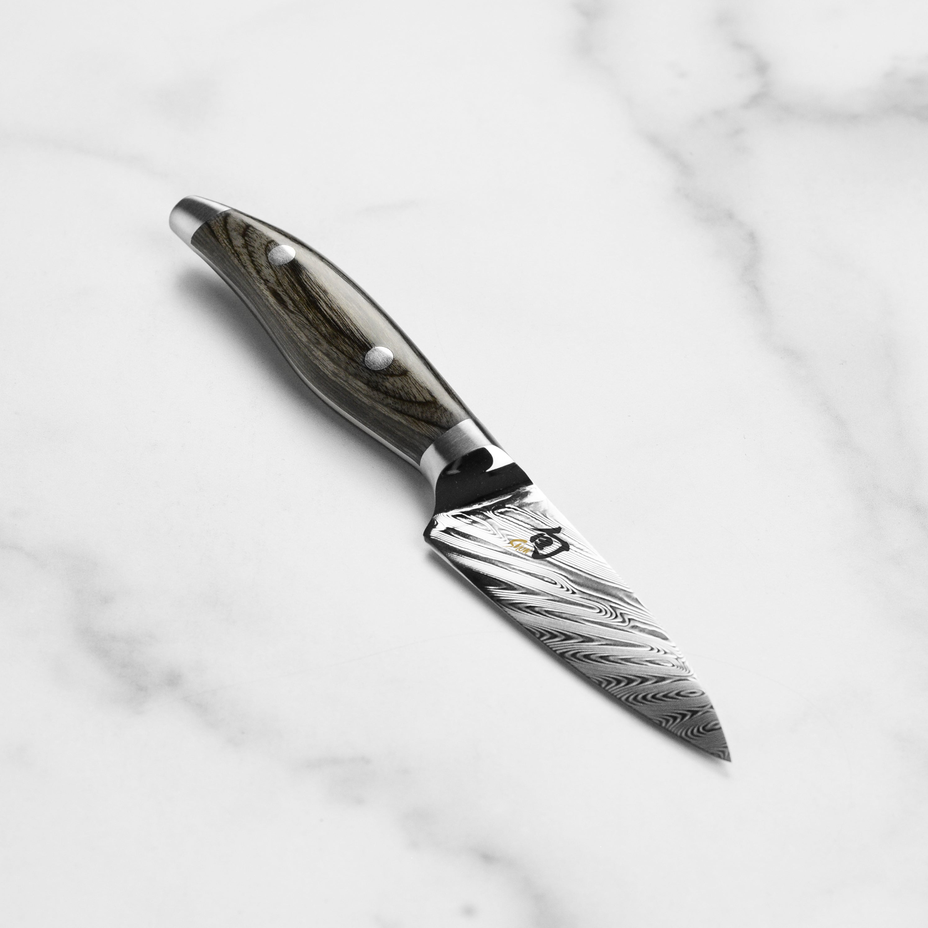 Shun Nagare 3.5-inch paring knife with Damascus layered blade and wooden handle for precise cutting