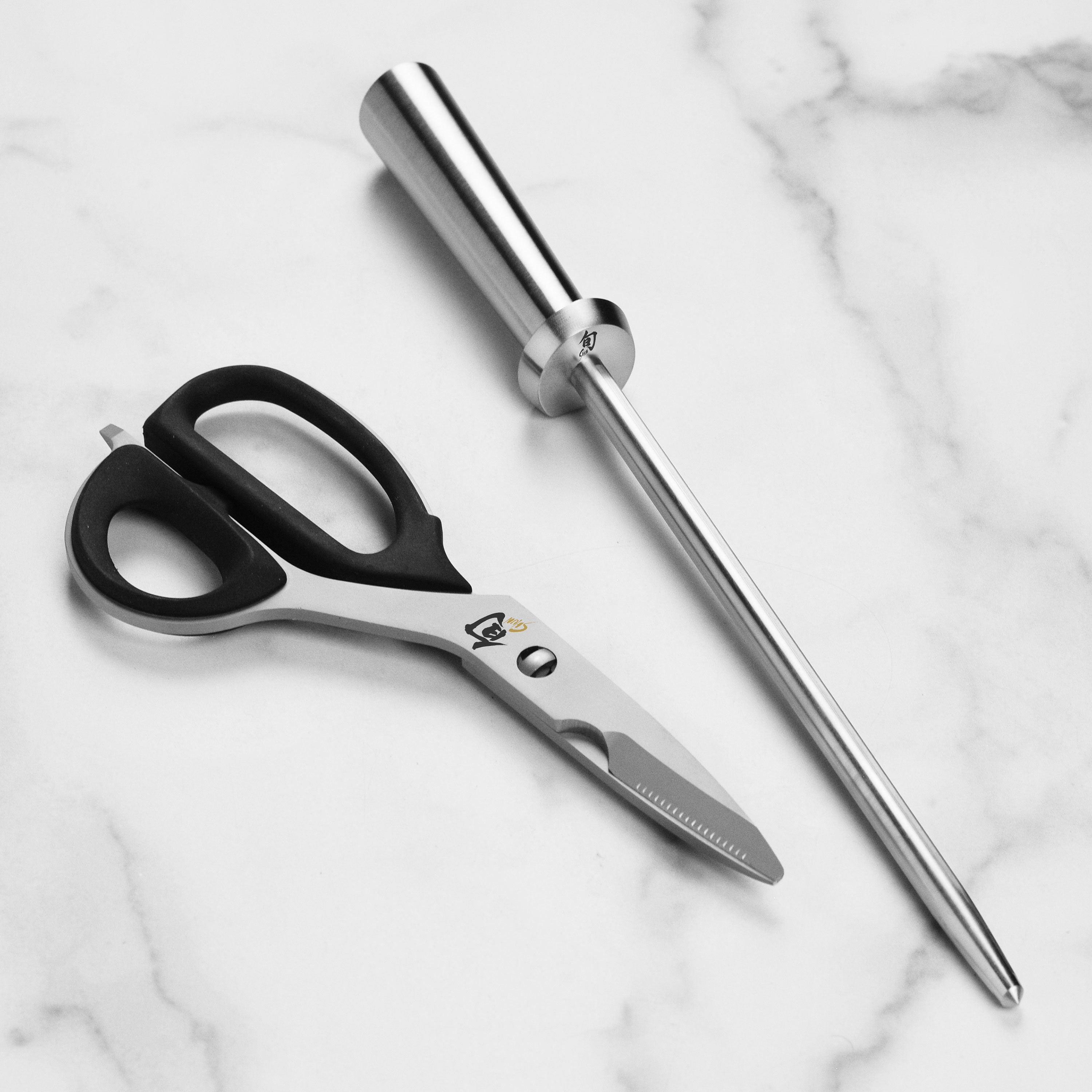 Chef using the Damascus knives for preparing gourmet dishes in a modern kitchen setting.