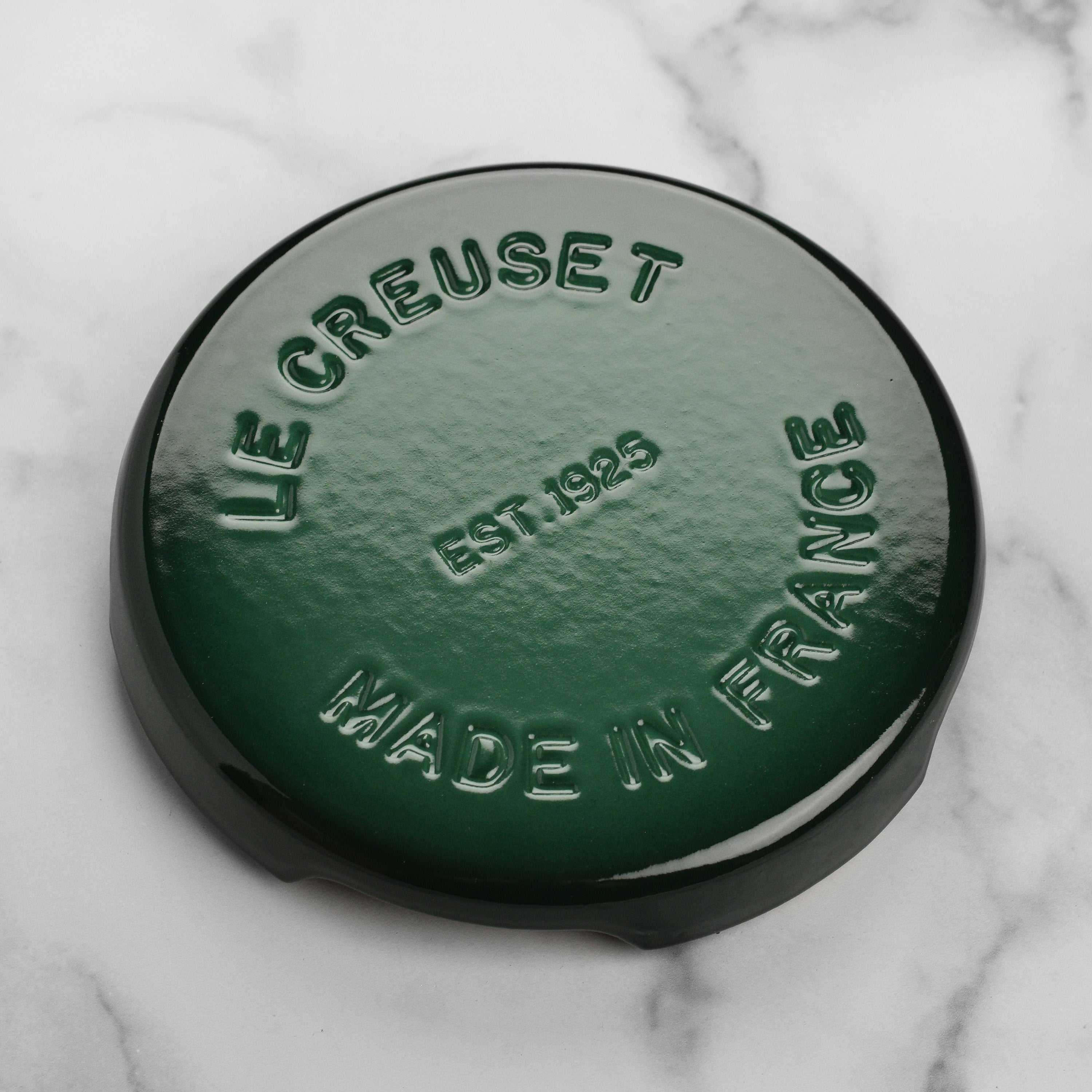 Close-up of Le Creuset Artichaut cast iron trivet with enameled surface