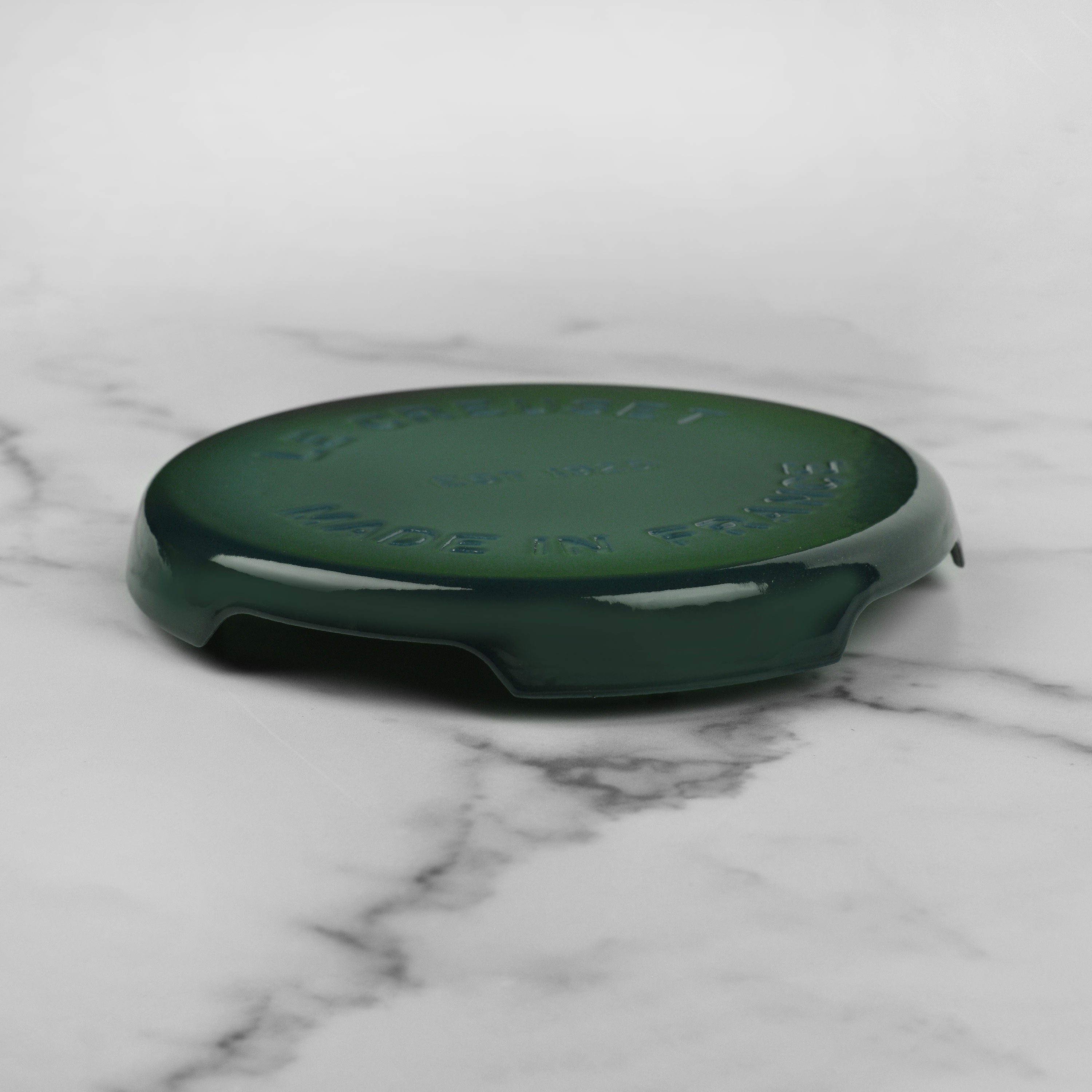 Close-up of Le Creuset Artichaut cast iron trivet with enameled surface