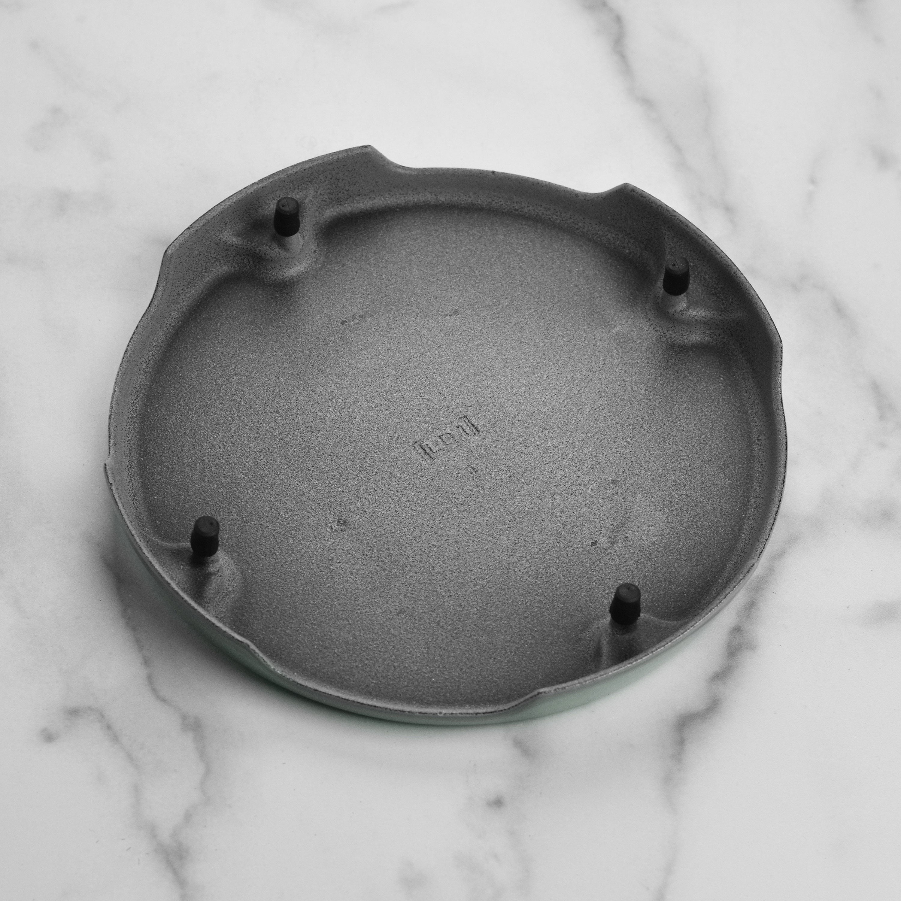 Le Creuset round trivet showcasing elevated design and enamel finish