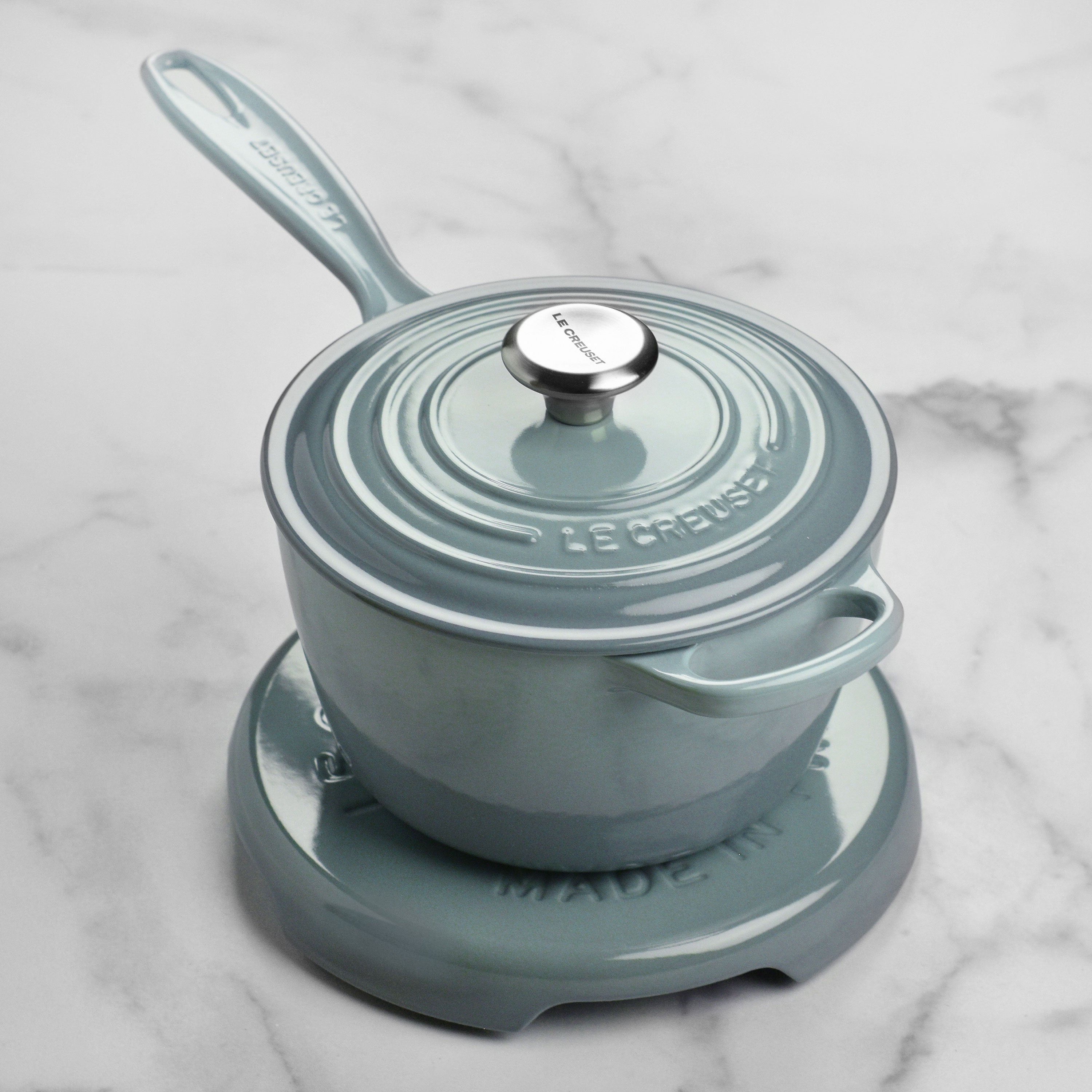 Durable cast iron trivet on a kitchen countertop, protecting surfaces from heat