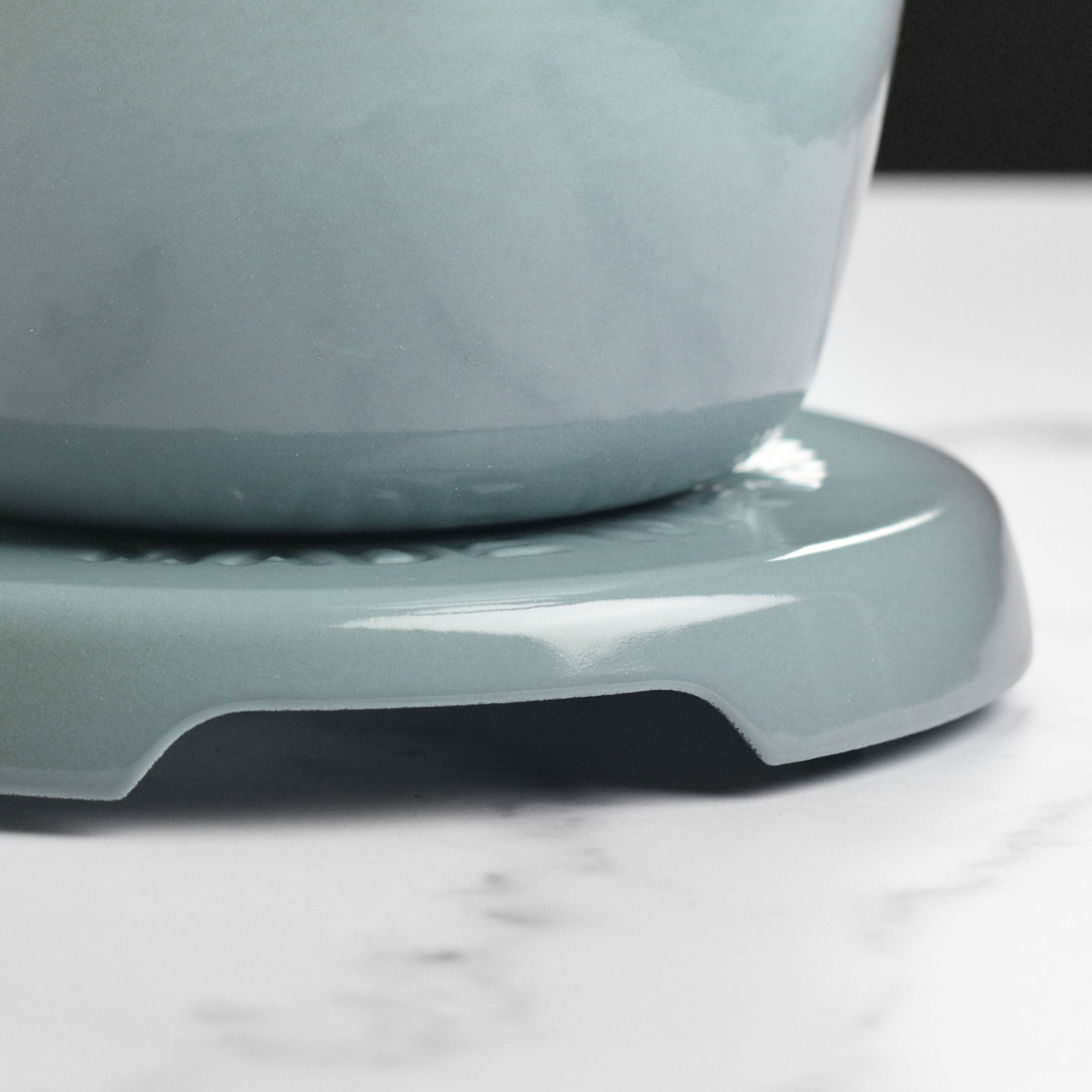 Close-up of Le Creuset enamel round trivet demonstrating quality craftsmanship