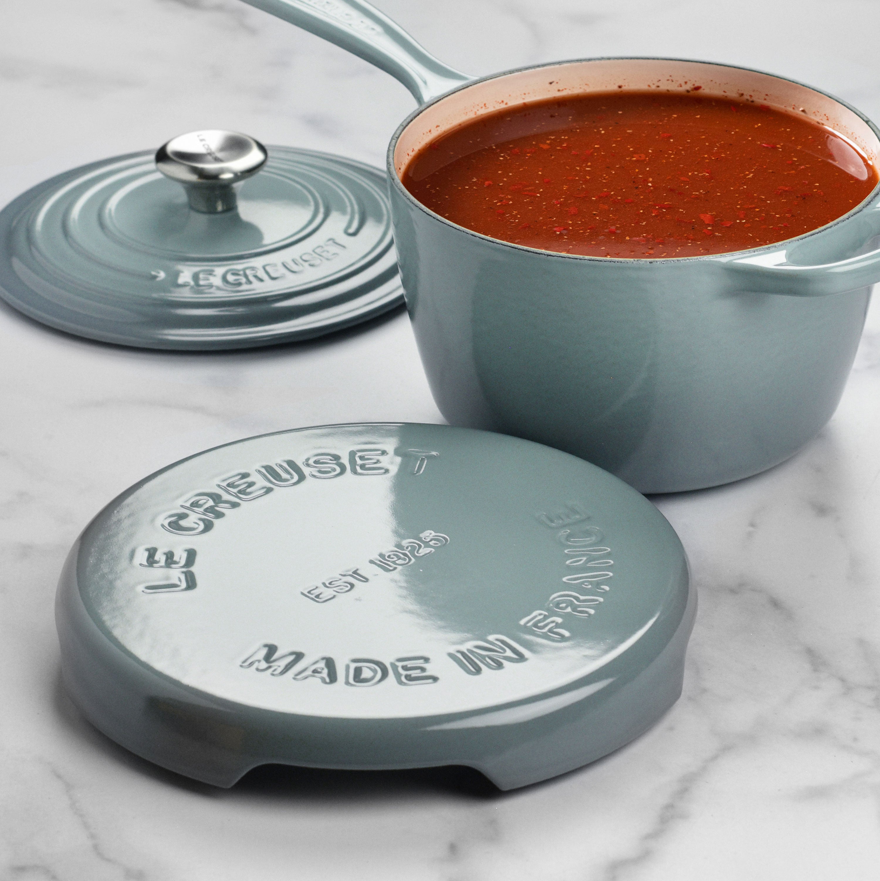 Durable cast iron trivet on a kitchen countertop, protecting surfaces from heat